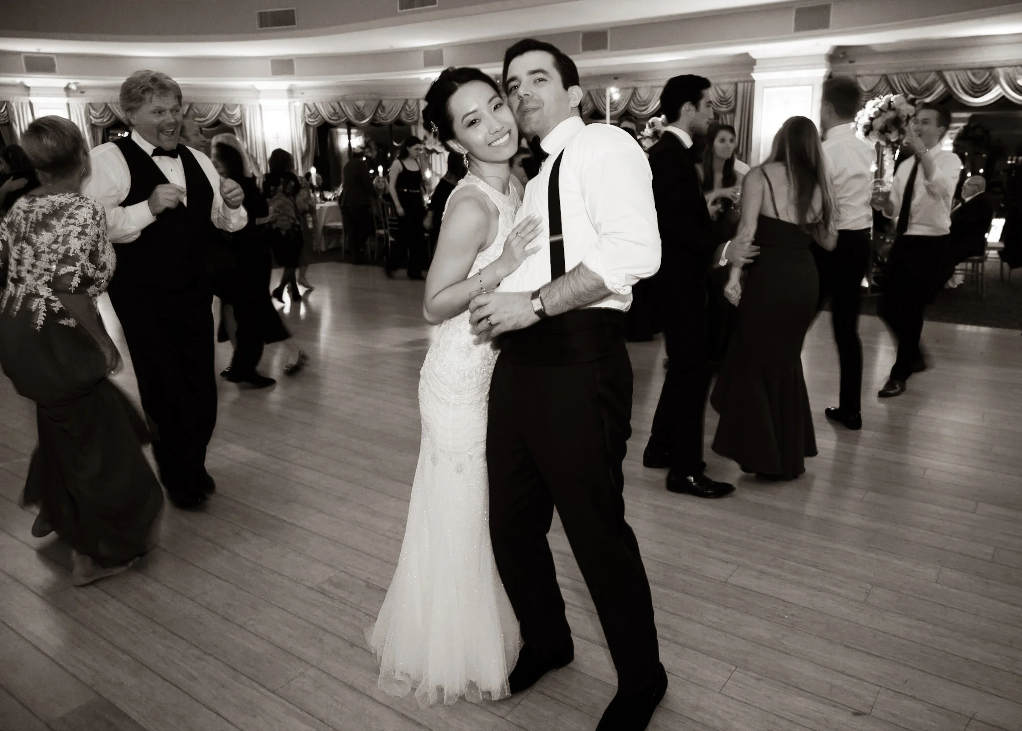 A bride and groom dancing at their wedding reception.