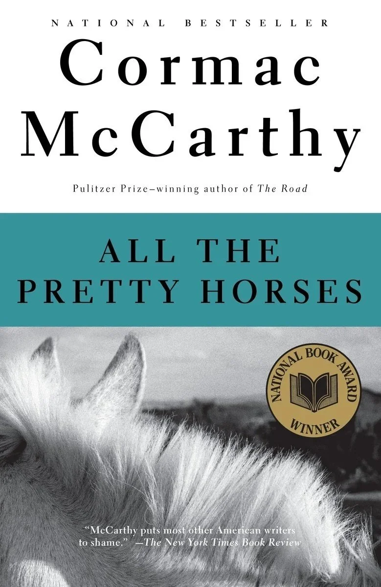 Book cover of "All the Pretty Horses" by Cormac McCarthy with a black and white photo of a horse's head on the bottom half and a gold badge that says "National Book Award Winner"