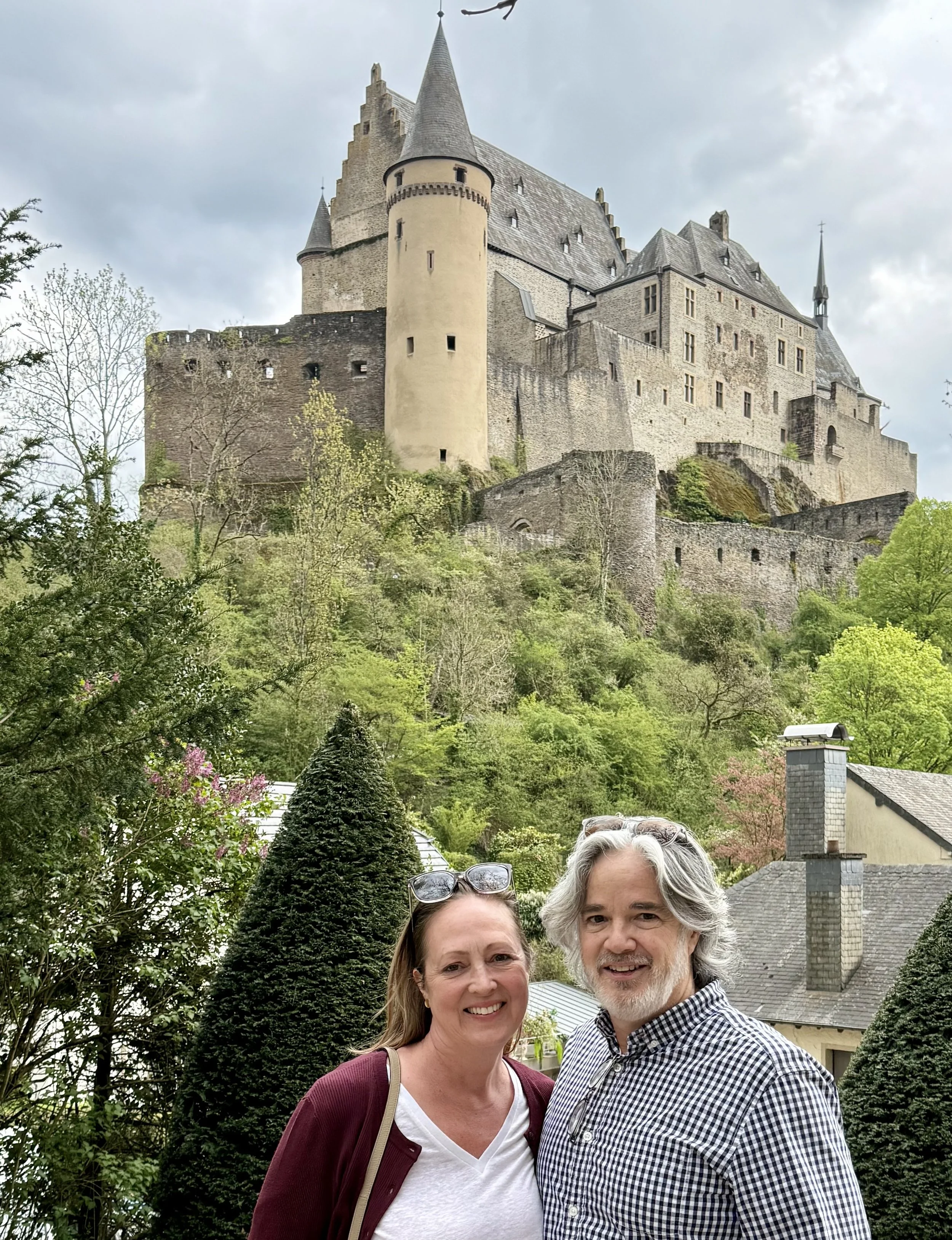 Bryan Koemptgen and Jennifer outside Vianden Castle in Vianden, Luxembourg. Located in northern Luxembourg, Vianden Castle is one of Europe's best-preserved medieval castles and one of the country's most iconic landmarks.