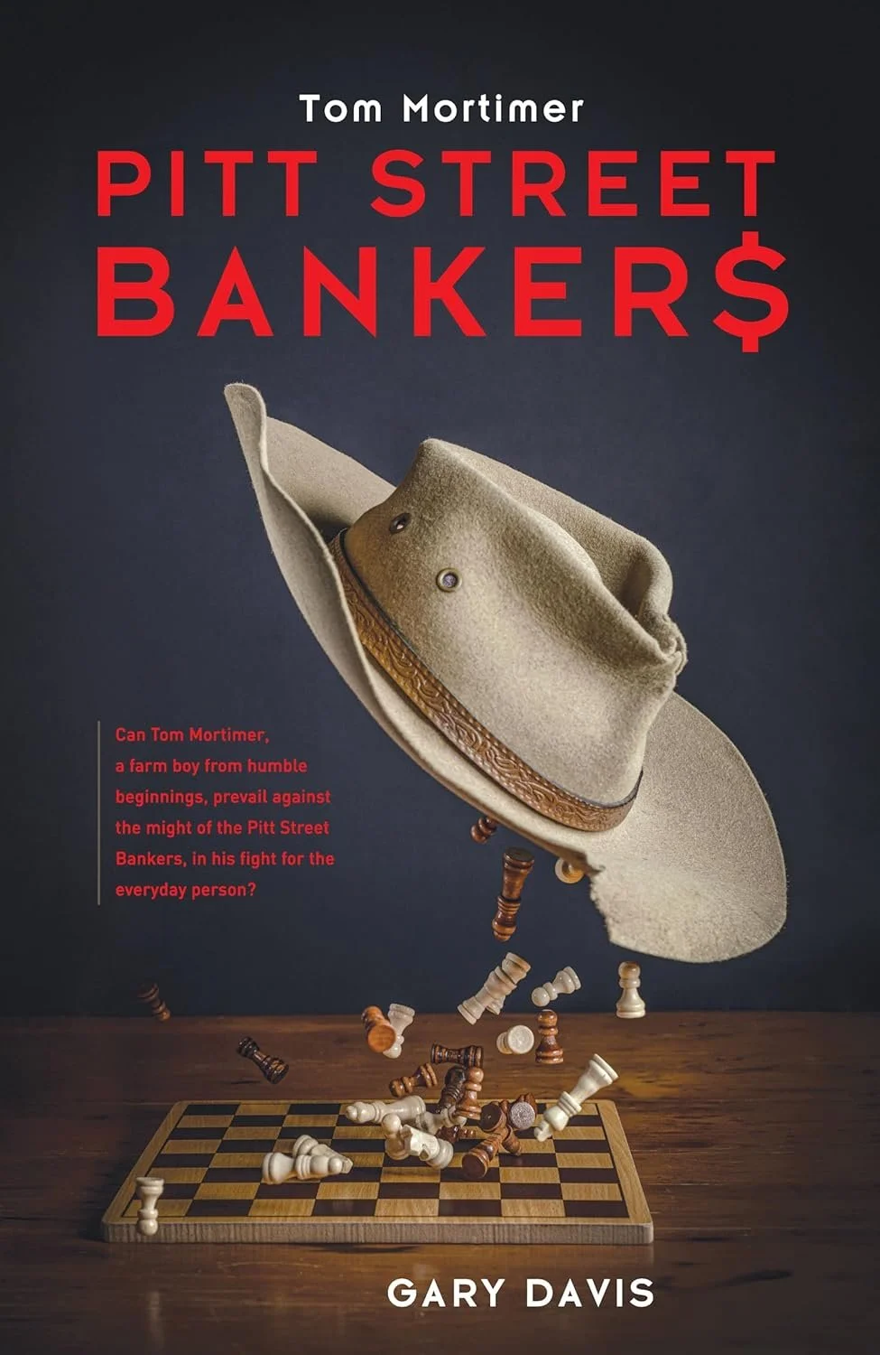 The cover of a book titled "Pitt Street Bankers" by Gary Davis. The cover features a cowboy hat suspended in mid-air, with chess pieces falling from it onto a chessboard. The subtitle reads, "Can Tom Mortimer, a farm boy from humble beginnings, prevail against the might of the Pitt Street Bankers, in his fight for the everyday person?" The author's name appears at the bottom.