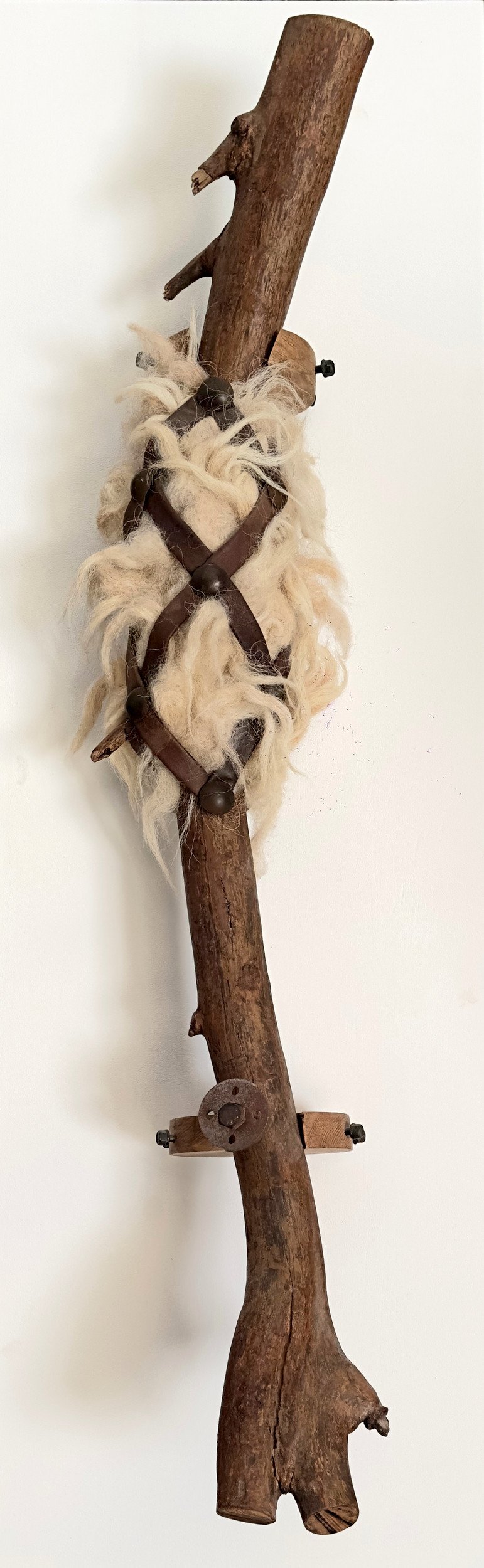 Encircled Body II 2022 wood, wool, leather, found materials 105 × 25 × 20 cm