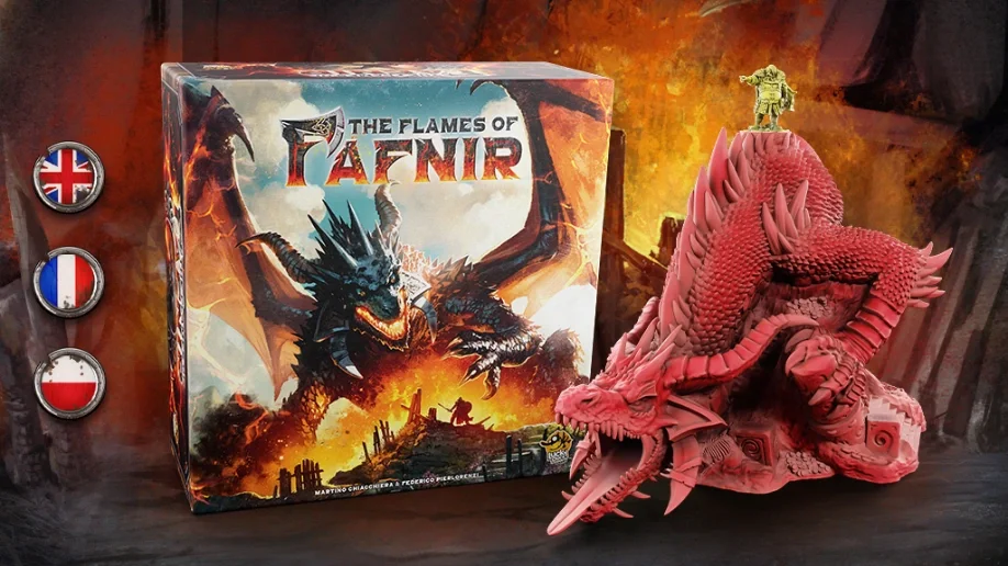 A tabletop game called "The Flames of TAFNIR" with a dragon-themed box art featuring a fierce dragon breathing fire and attacking, and a large pink dragon figurine with detailed scales and horns next to it. The background shows a fiery scene, and there are flags on the left side indicating language options.