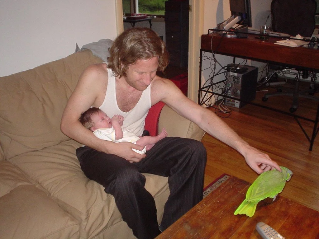 Evan Harrison with daughter Luli and pet parrot Edie in Montclair 2004