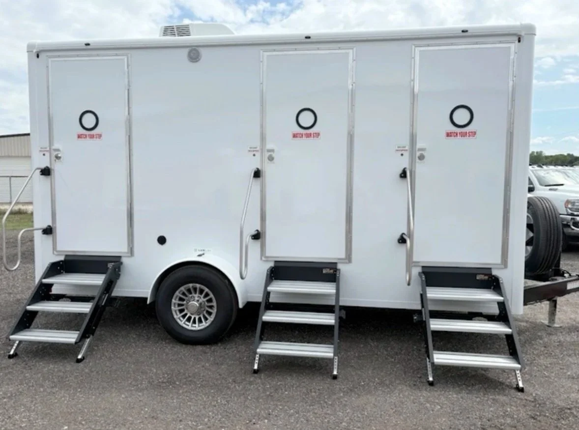 Luxury Portable Bathroom Trailer 3 individual stalls, perfect for weddings, events, birthday parties, emergencies, long term rentals for contractors, long term rentals for work sites, corporate events and more