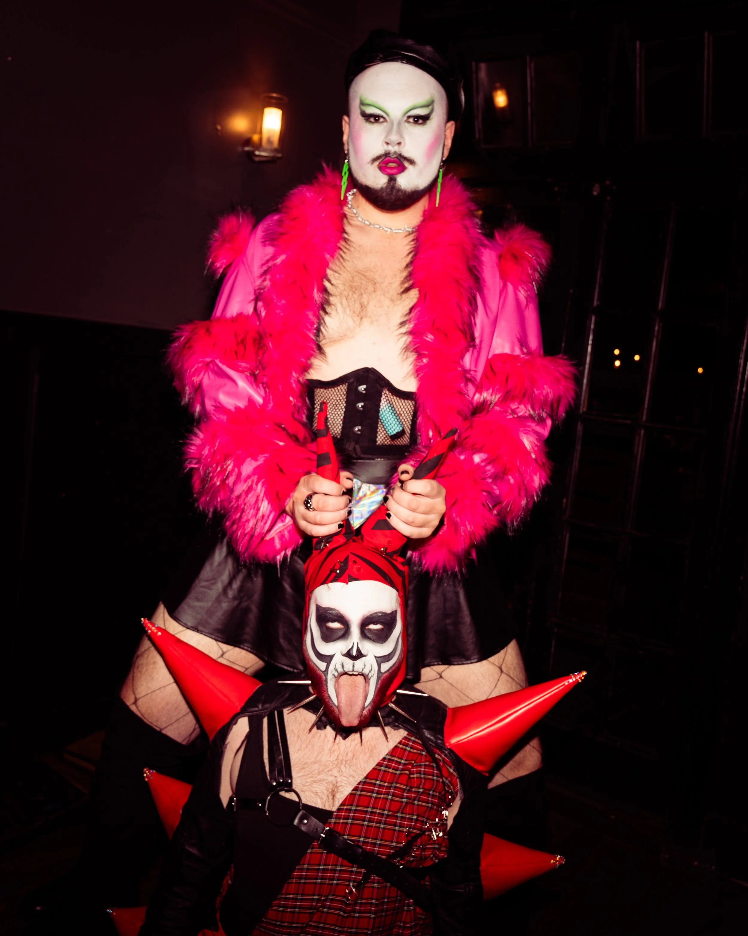 Two androgynous drag artists.