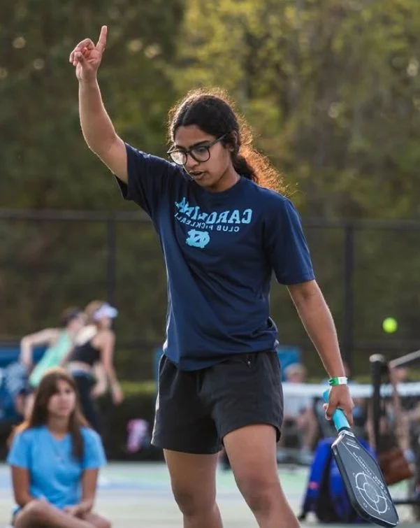 Jayna coaching pickleball on the court