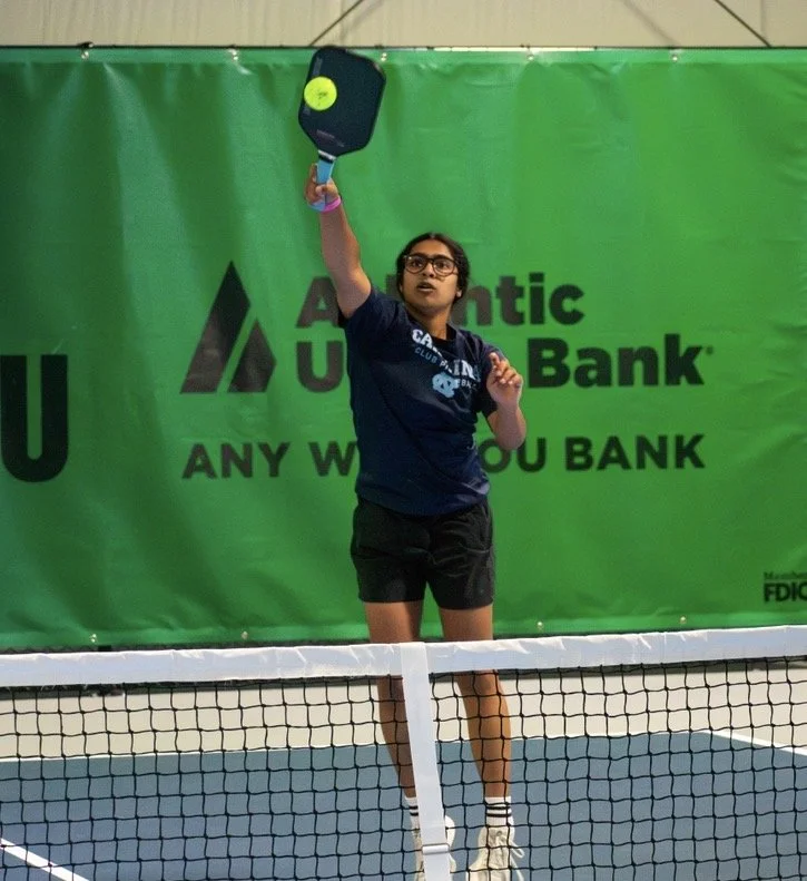 Jayna competing on a pickleball court