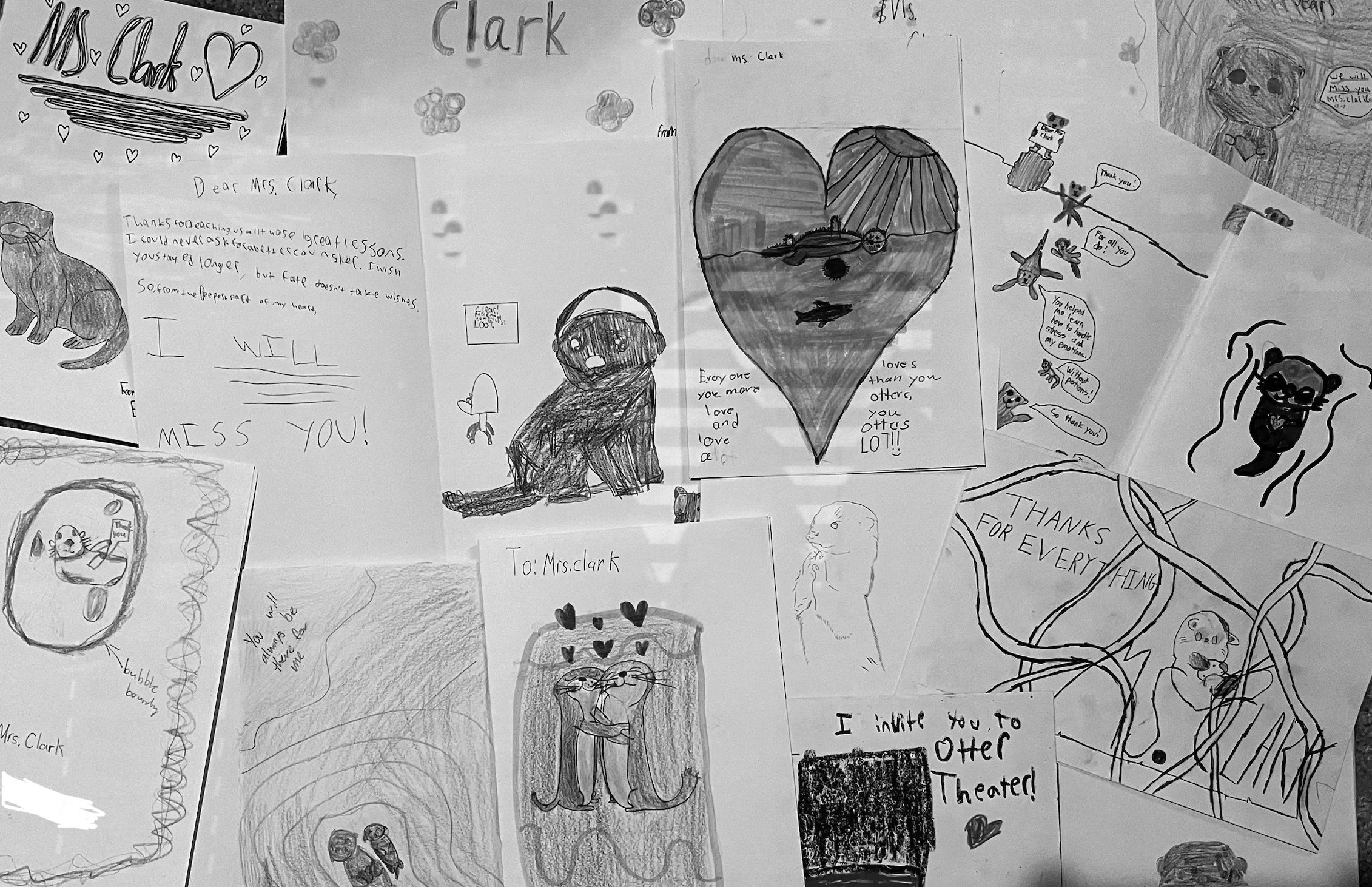 A collage of various children's handwritten and drawn cards and notes, many of which include messages of love and gratitude, along with drawings of animals, hearts, and scenes.