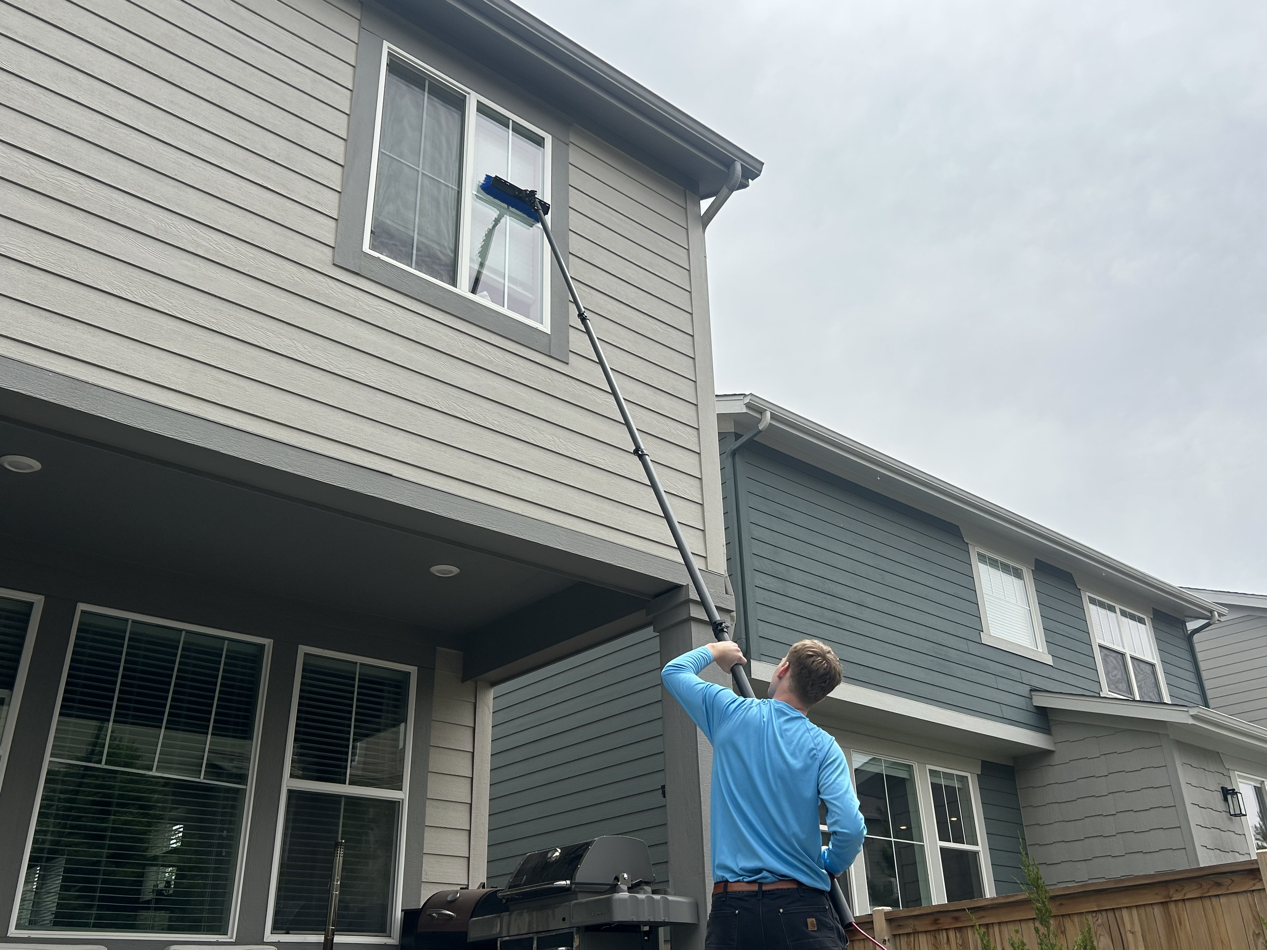 Residential window cleaning service using a water-fed pole system in Douglas and El Paso County.