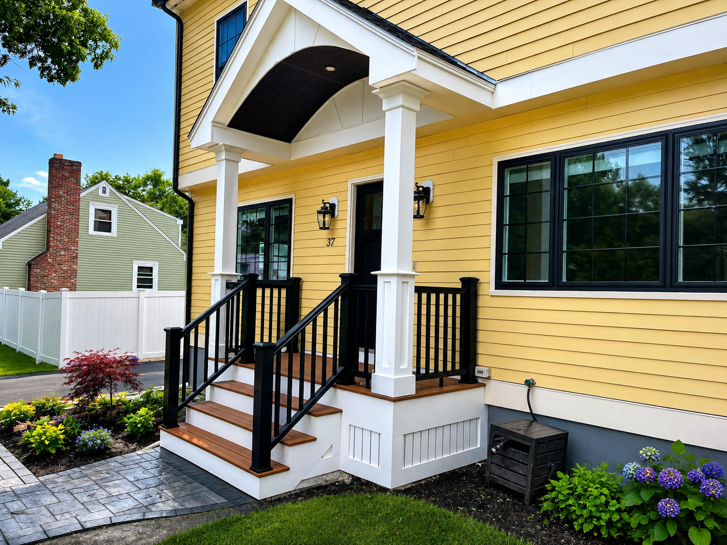 Charming suburban entryway with lush landscape