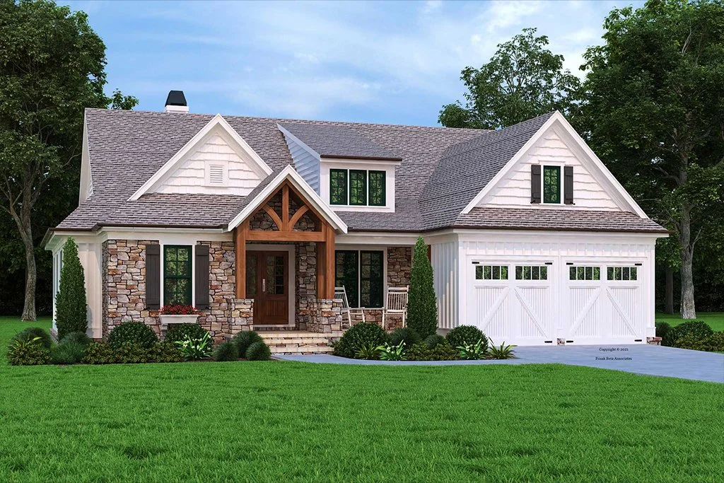 A modern house with a stone and white siding exterior, a gable roof, a front porch with wooden beams, and a white garage door, surrounded by green lawn and trees.