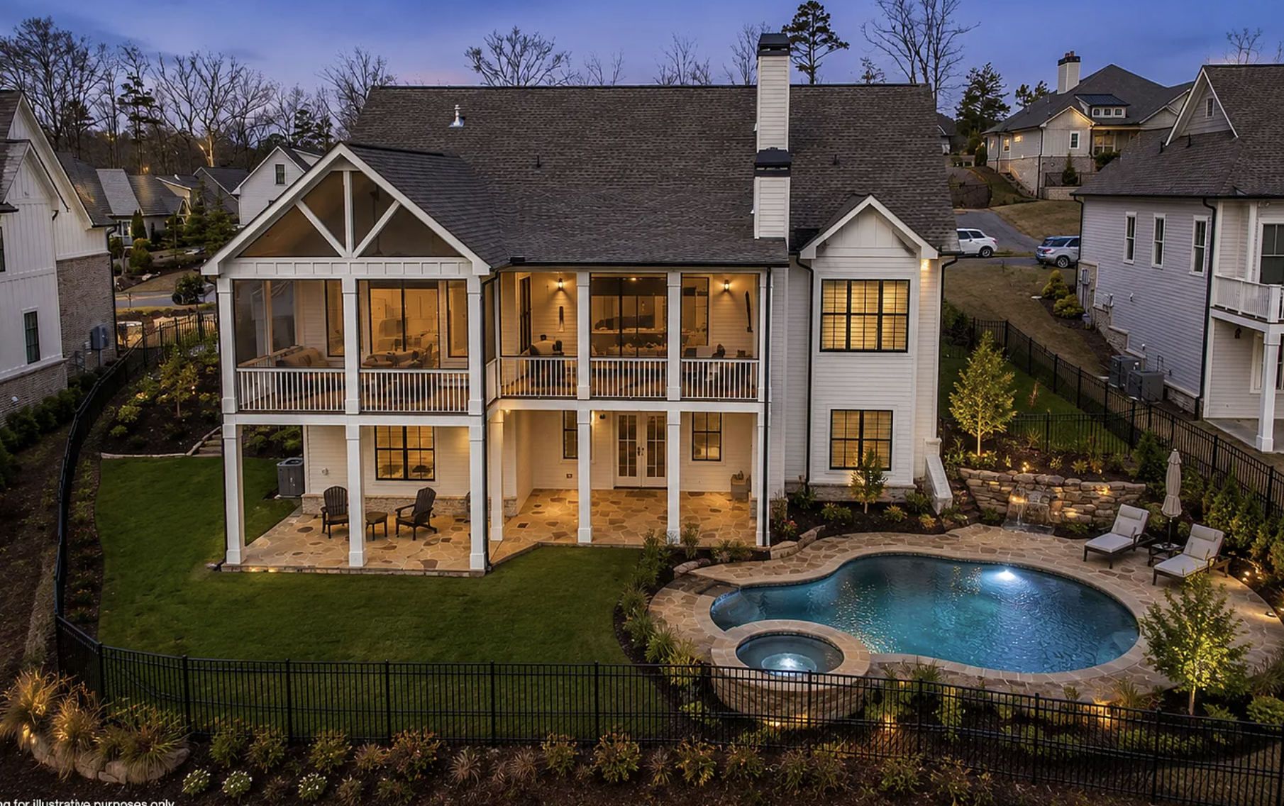 A multi-story house with a backyard that includes a swimming pool, patio, and landscaped garden, surrounded by a fence, with neighboring houses and trees in the background during evening.