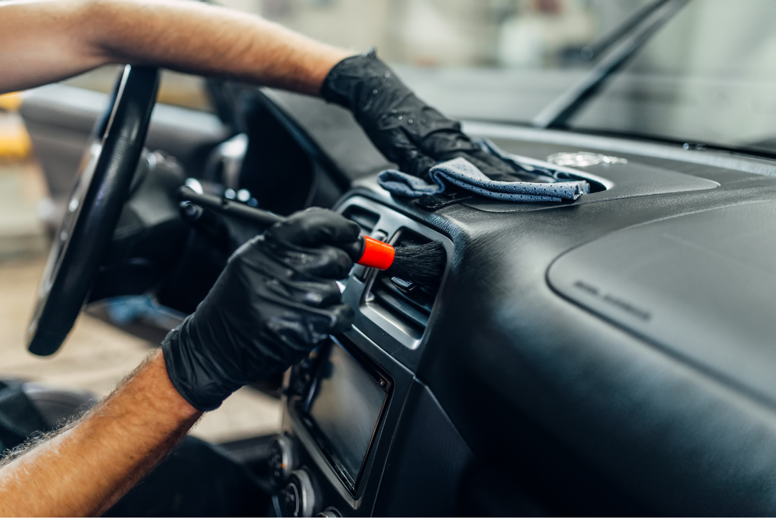 Protecting and restoring a vehicle dashboard during a professional interior auto detailing service in Ocala, FL
