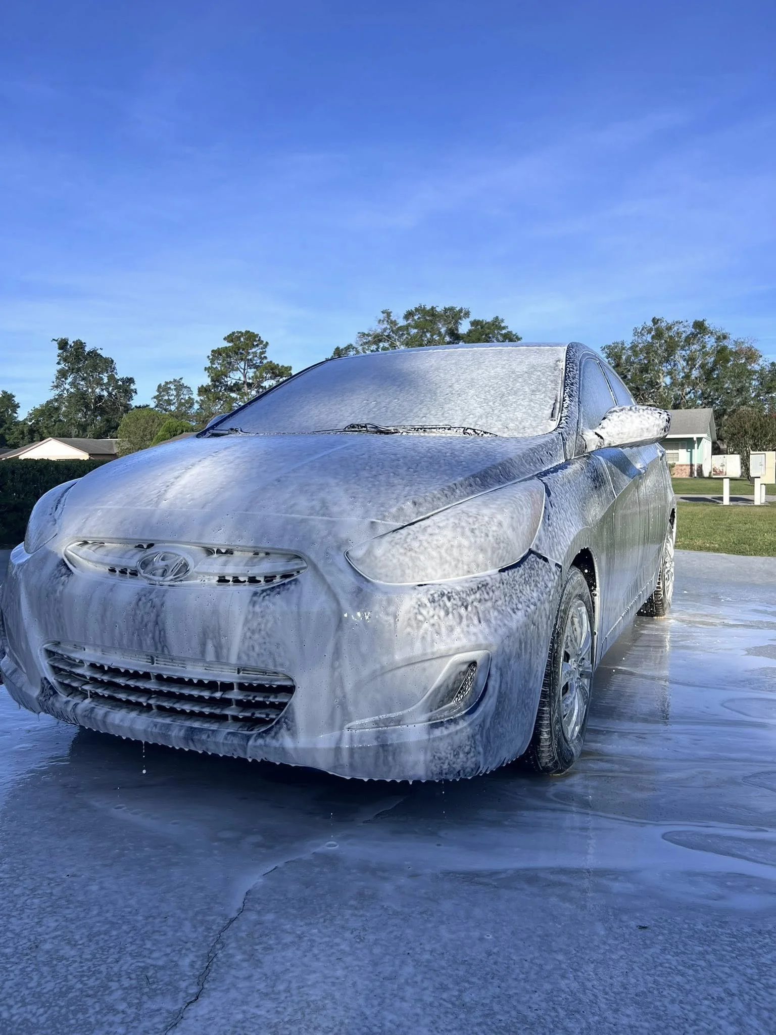 Premium exterior detailing with thick foam pre-soak to safely remove dirt before hand washing in Ocala, FL