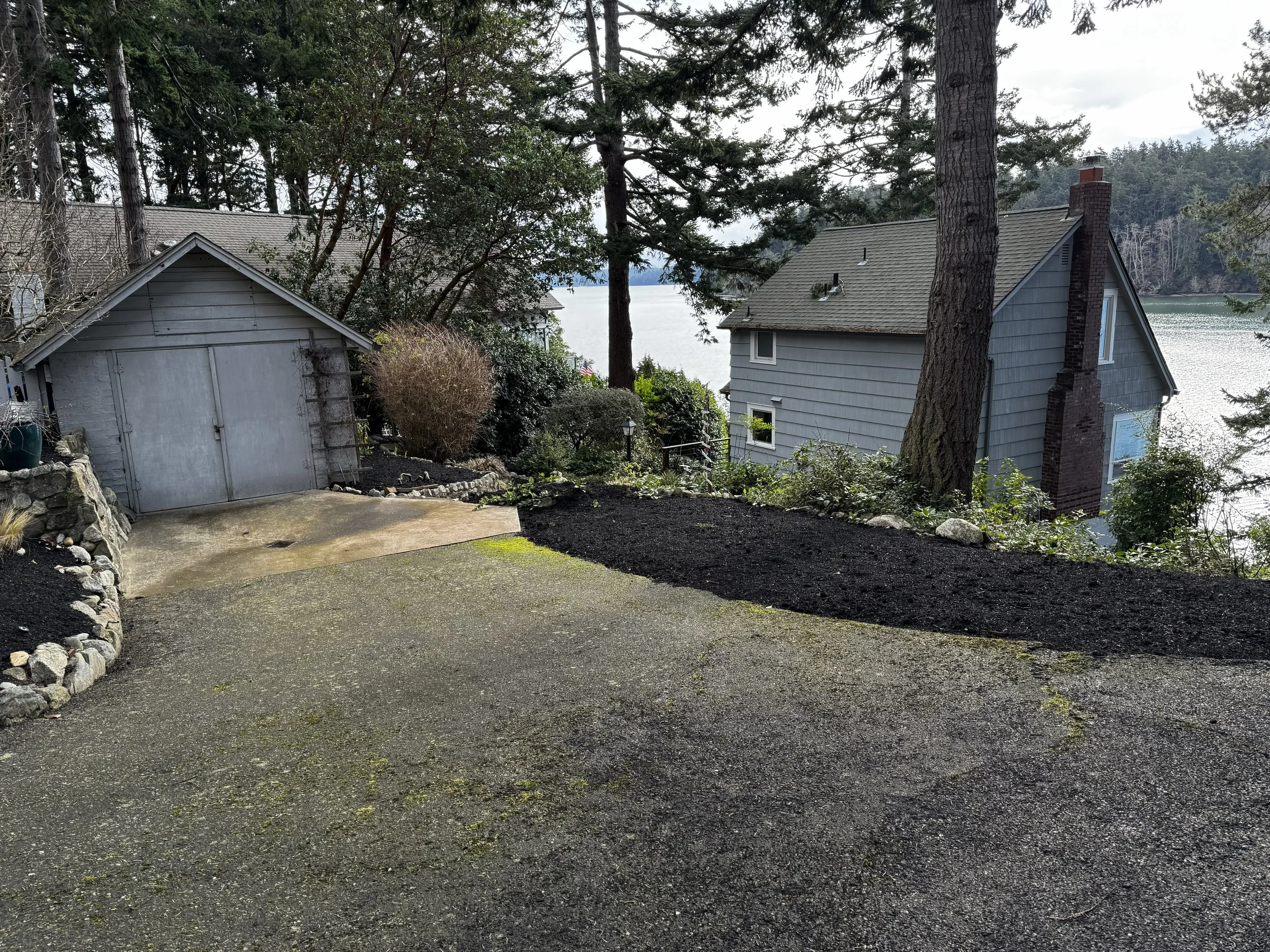 Your view as you enter the property.  The original charming garage that has great potential for a greenhouse, studio or workshop. 