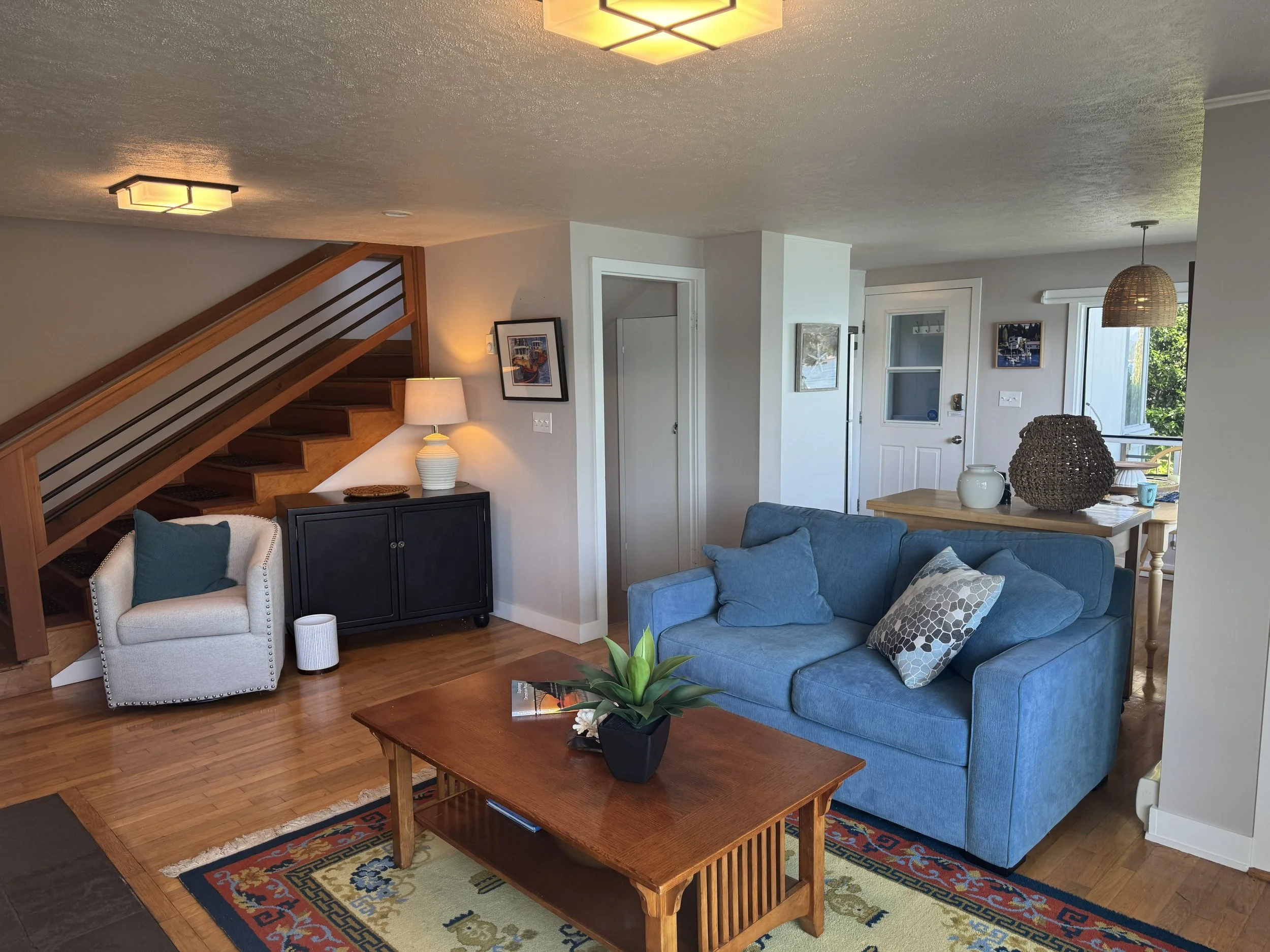 The stairs to the upper level are original from 1945.  You step on old growth wood steps and touch vintage lath and plaster walls on your way up to a large master bedroom suite.