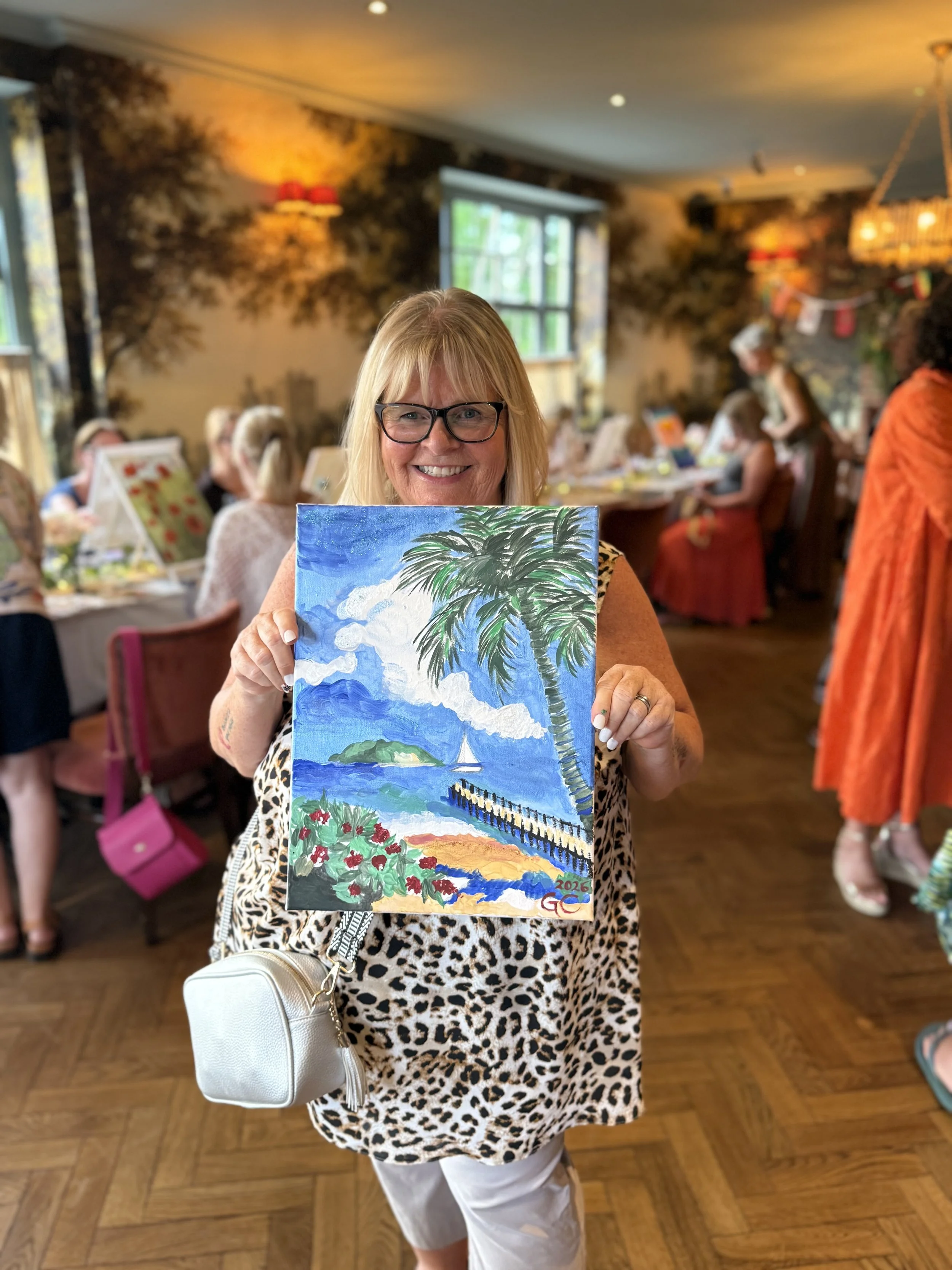 guest-holding-finished-landscape-painting.jpeg