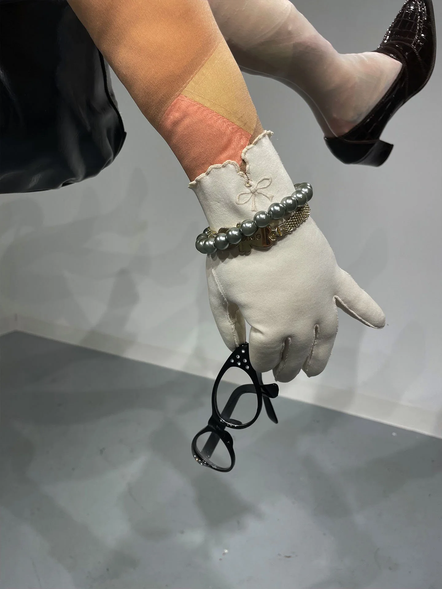 "The Little Old Lady Who Lived In Her Purse", 2025. Various fabrics, stockings, women’s leather heels, purse, glasses, gloves, jewelry, pins.
Winner of the 2025 Rhodes College Juried Art Show