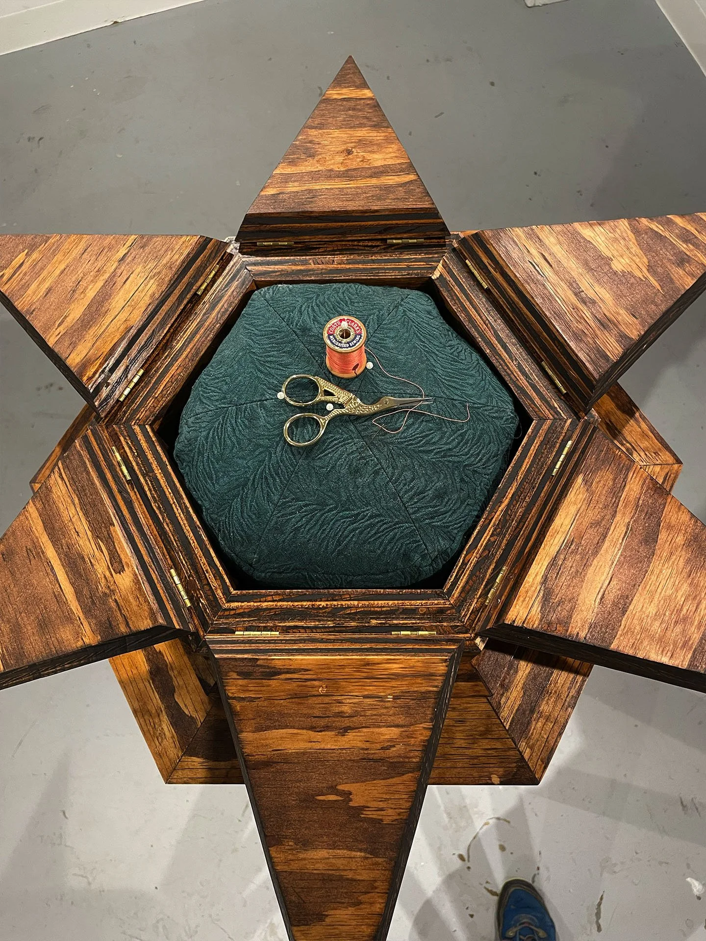 "Reliquary", 2025. Wood, brass hinges, gold leaf, fabric, thread, thread snips, sewing pins