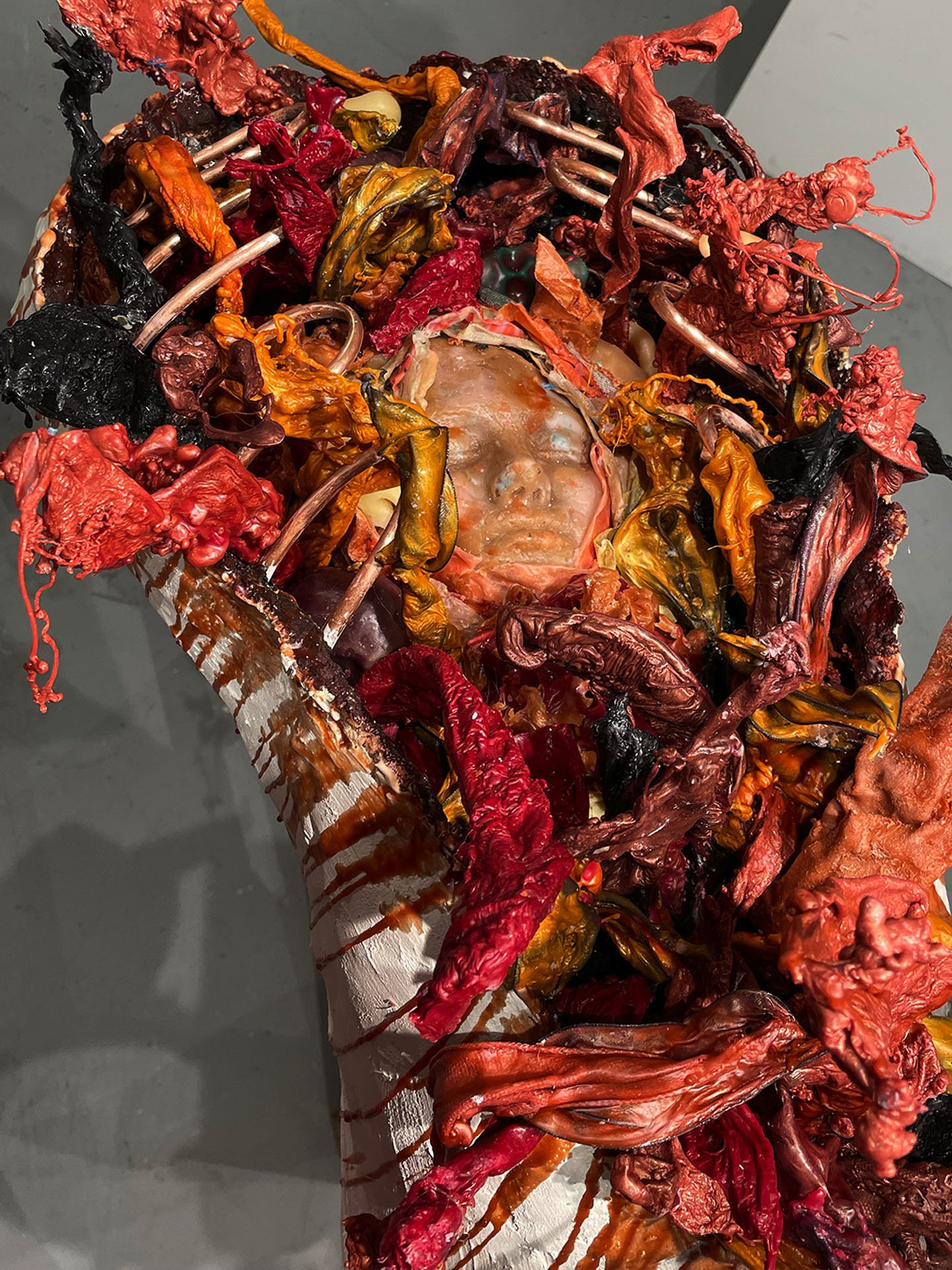 "Spill Your Guts", 2025. Beeswax & thermoplastic wax, plaster, copper, old barn wood.