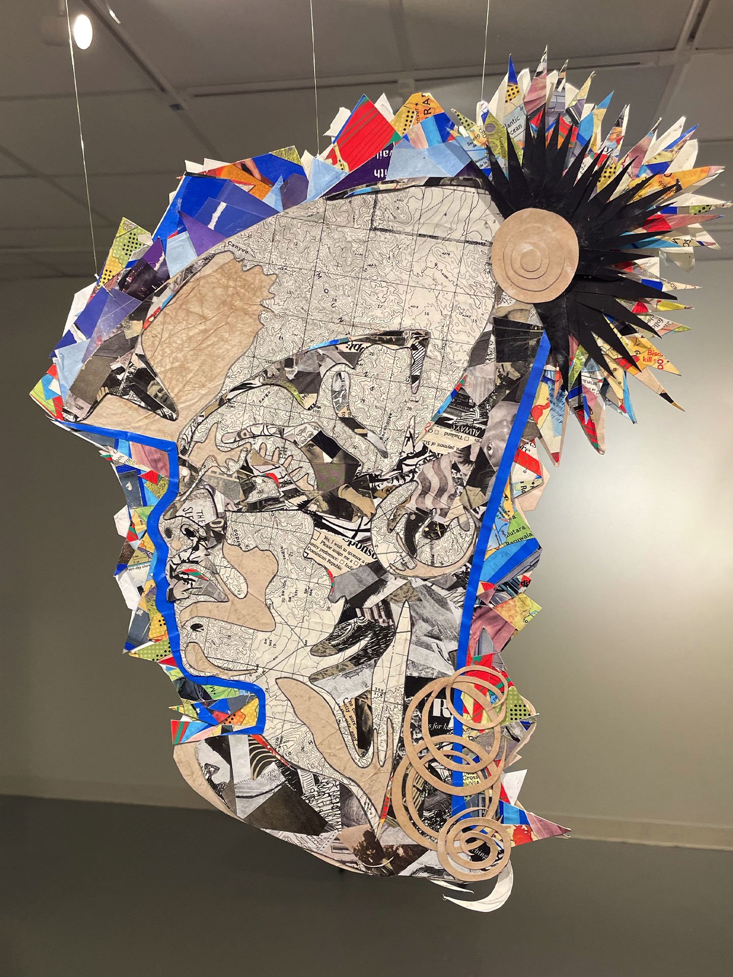 "The Admiral", 2024. Double-sided collage. Newsprint, magazines, old topographic map, tissue paper, glue. Featured in the 2024 Rhodes College Juried Show.