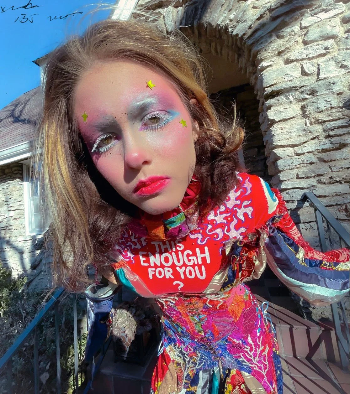 "IS THIS ENOUGH FOR YOU? (Patchwork No.1)", 2023. From the Patchwork Photo Series. 
Various fabrics, pearl beads, chain, boning, brass eyelets & fasteners, pleather boots, bodysuit, paint.
Makeup & Photography by Lillian Hall.