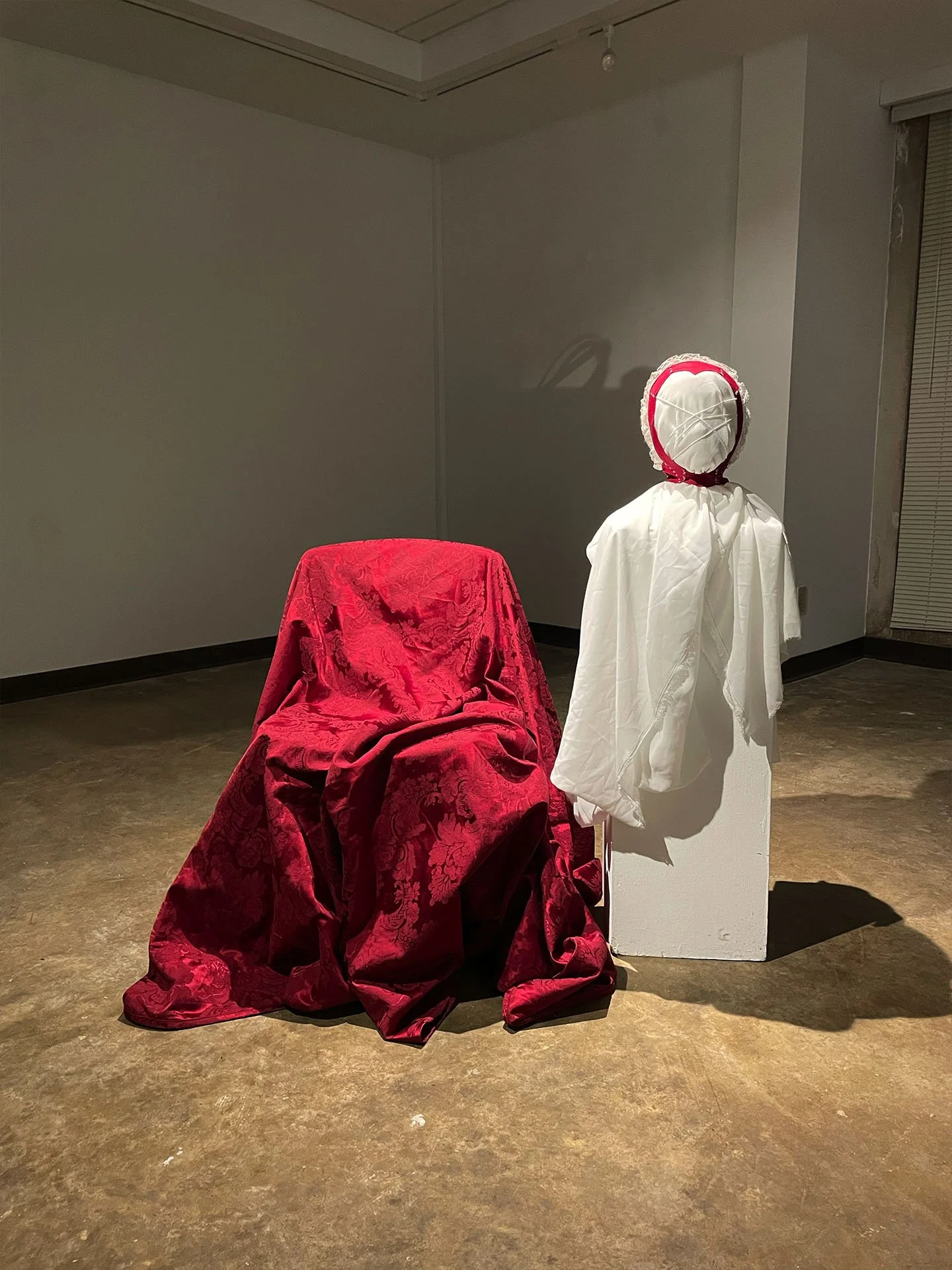 "Eyes In the Back of Her Head", 2026. Installation & Wearable Art. Fleece & various fabrics, lace, embroidery floss, foam clay, Polyfill. Photographed by Alana Reese-Walker.