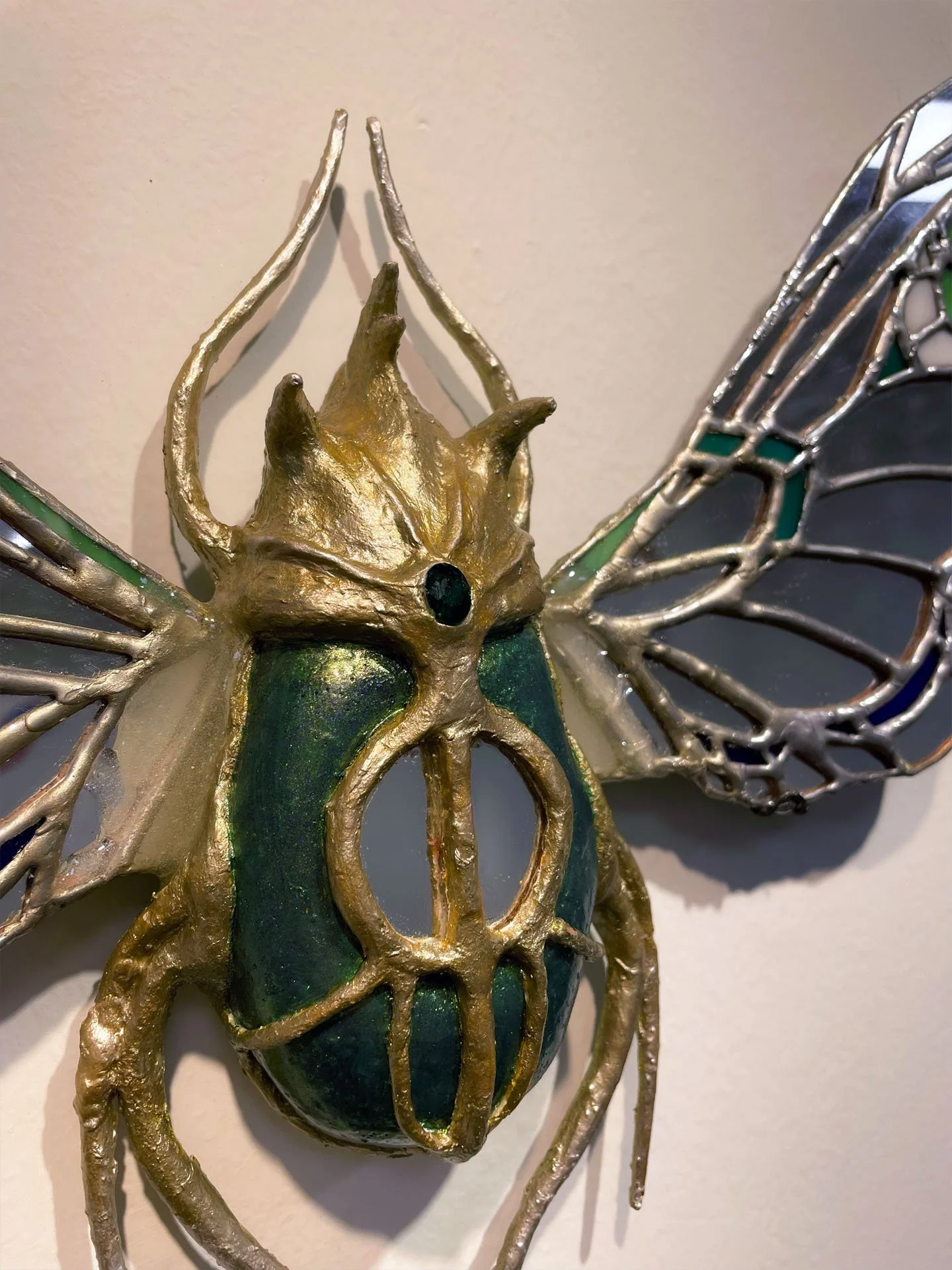 "The Beetle", 2025. Stained glass & mirror, jewels, resin, clay, wire. 
Winner of the 2025 Rhodes College Juried Art Show