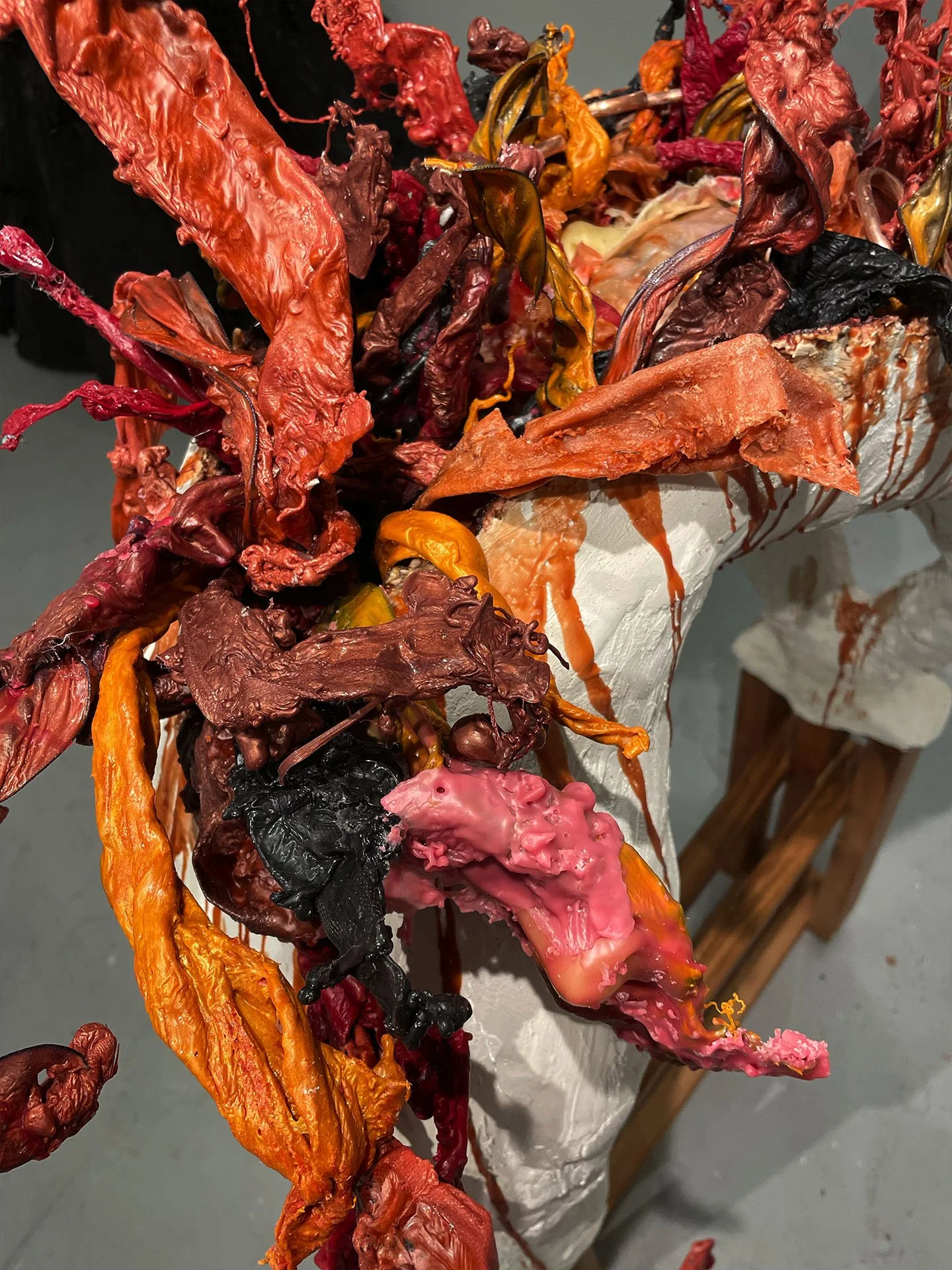 "Spill Your Guts", 2025. Beeswax & thermoplastic wax, plaster, copper, old barn wood.
