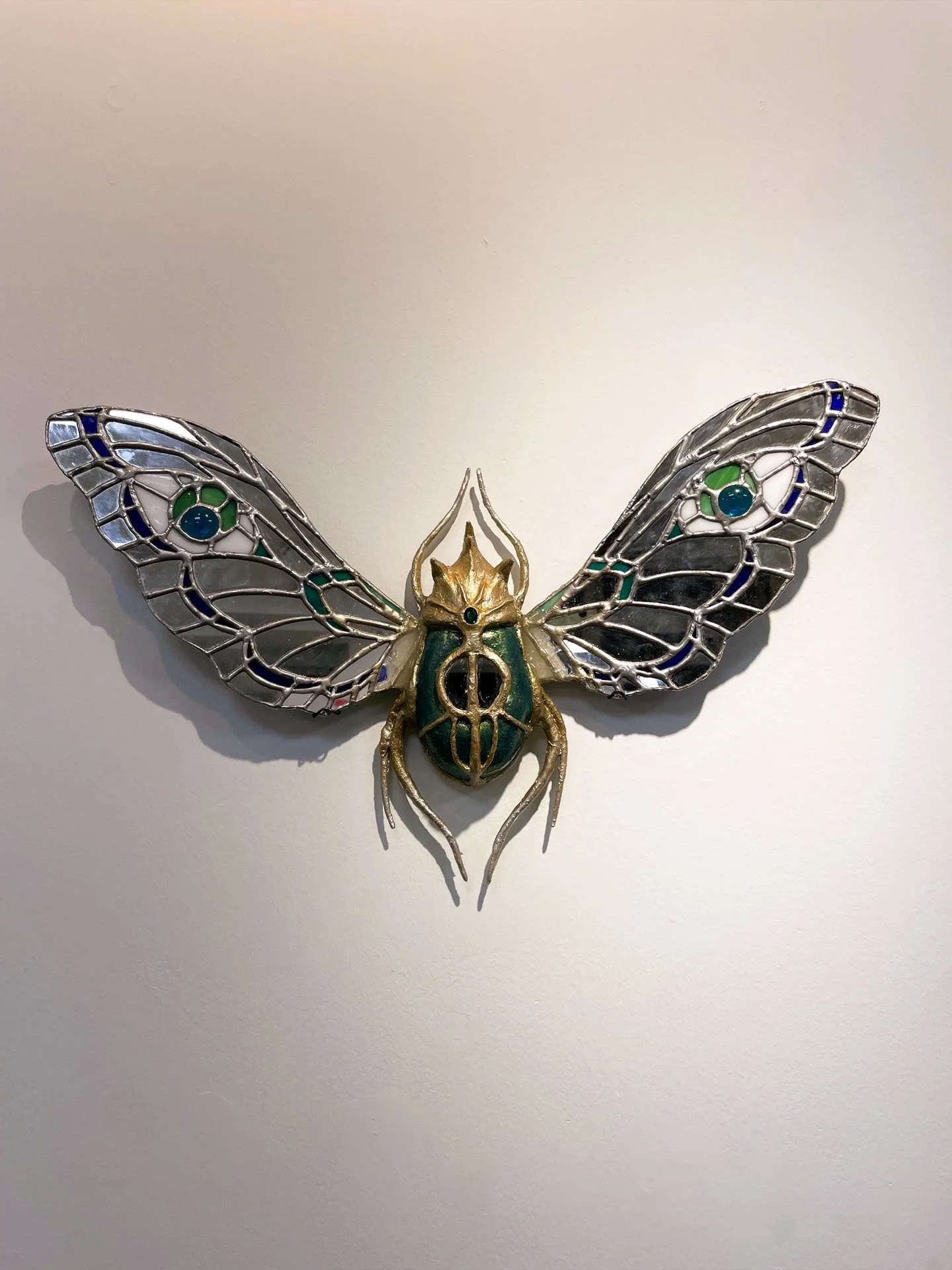 "The Beetle", 2025. Stained glass & mirror, jewels, resin, clay, wire. 
Winner of the 2025 Rhodes College Juried Art Show