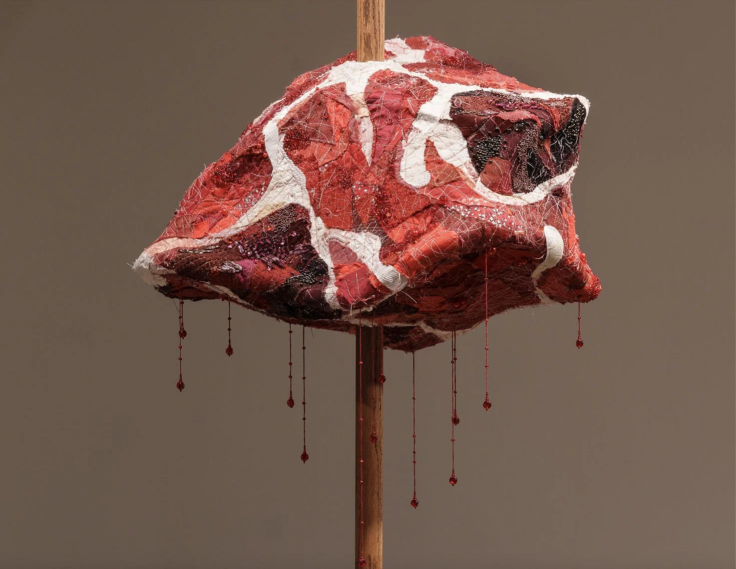 "RAW (meatstick)", 2026. Assorted collaged fabric, thread, wood, wire, pearls & beads. Featured in the 2026 Senior Thesis Exhibition at Rhodes College. [SOLD]