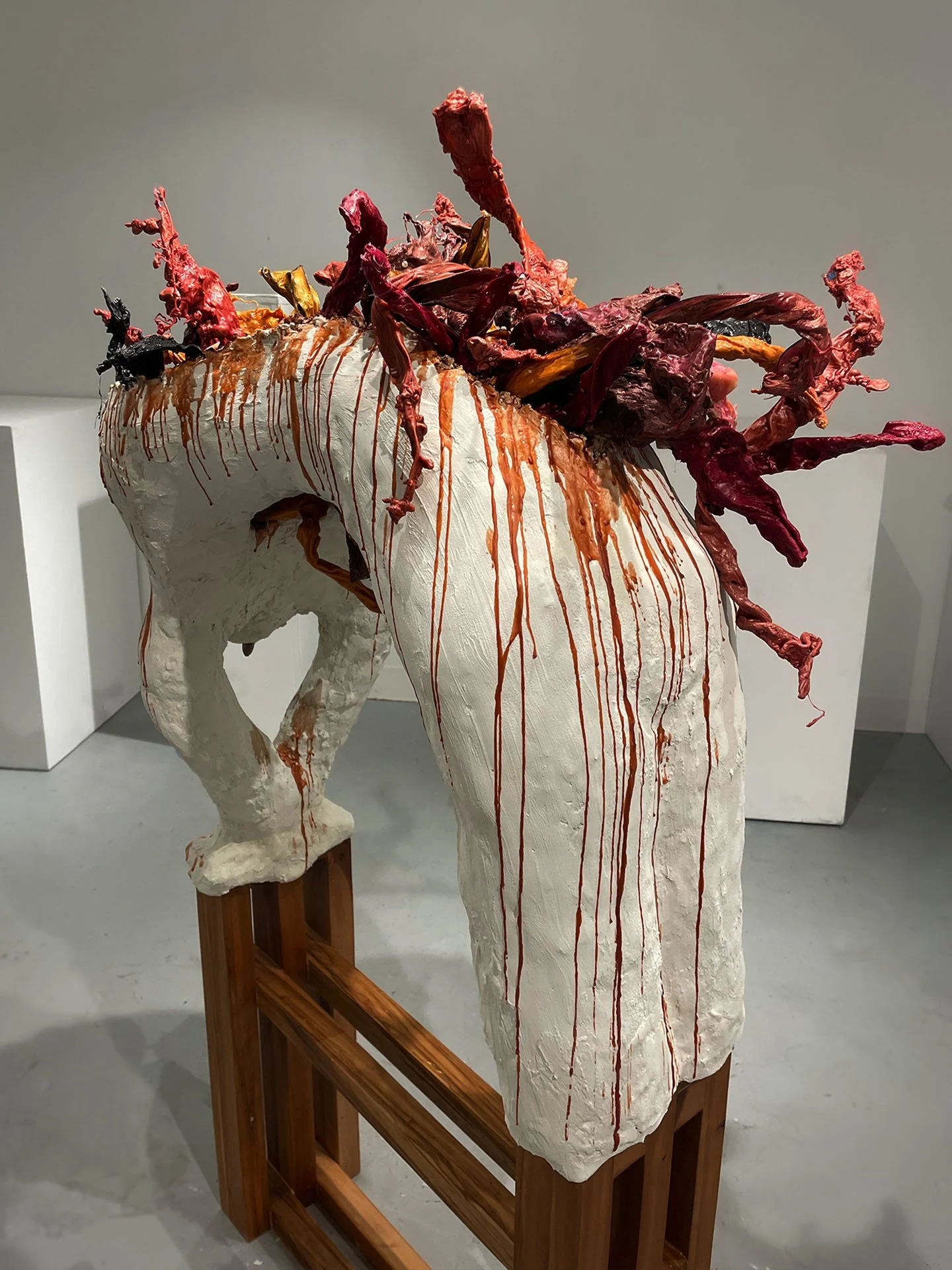 "Spill Your Guts", 2025. Beeswax & thermoplastic wax, plaster, copper, old barn wood.