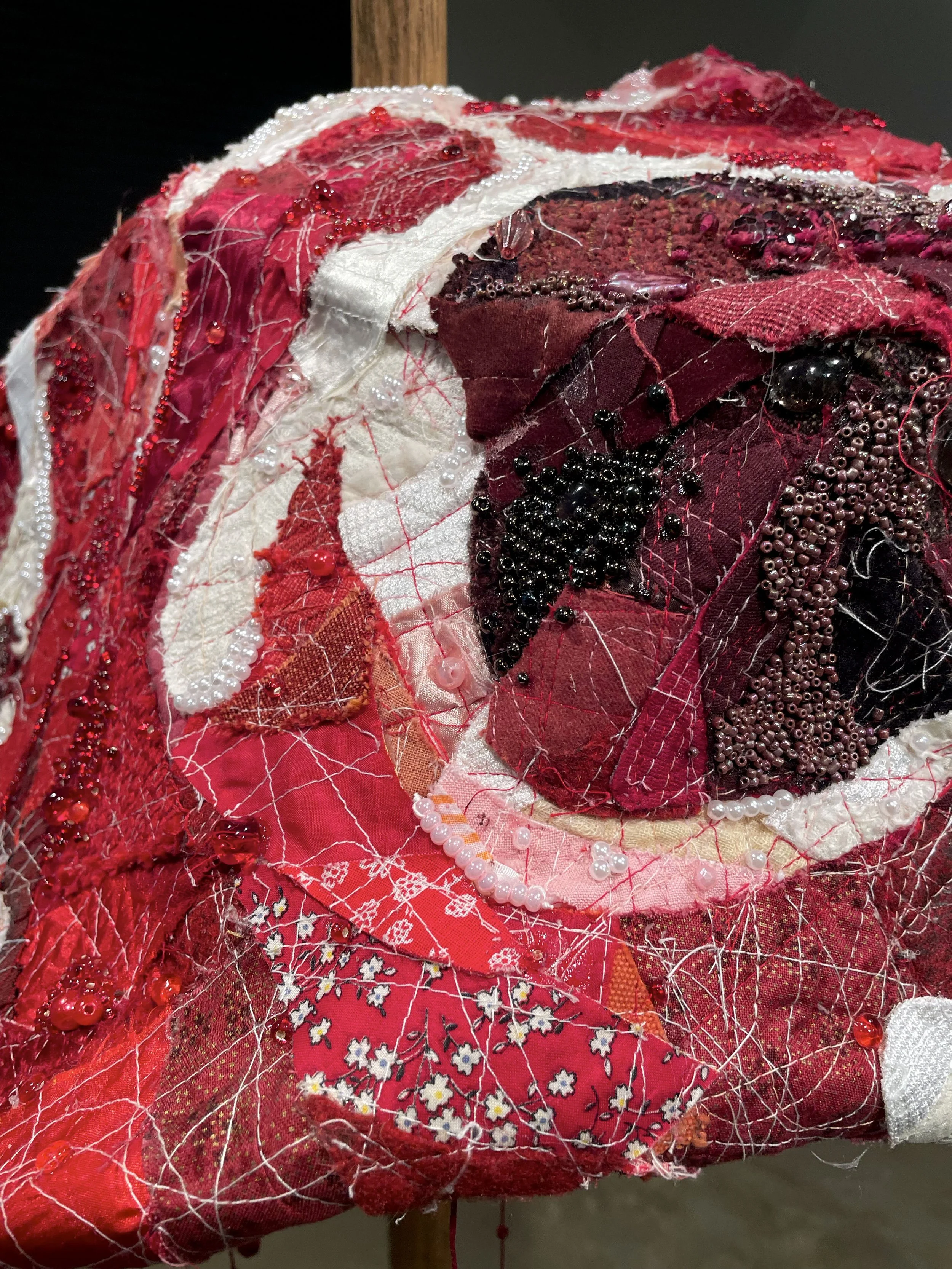 "RAW (meatstick)", 2026. Assorted collaged fabric, thread, wood, wire, pearls & beads. Featured in the 2026 Senior Thesis Exhibition at Rhodes College. [SOLD]