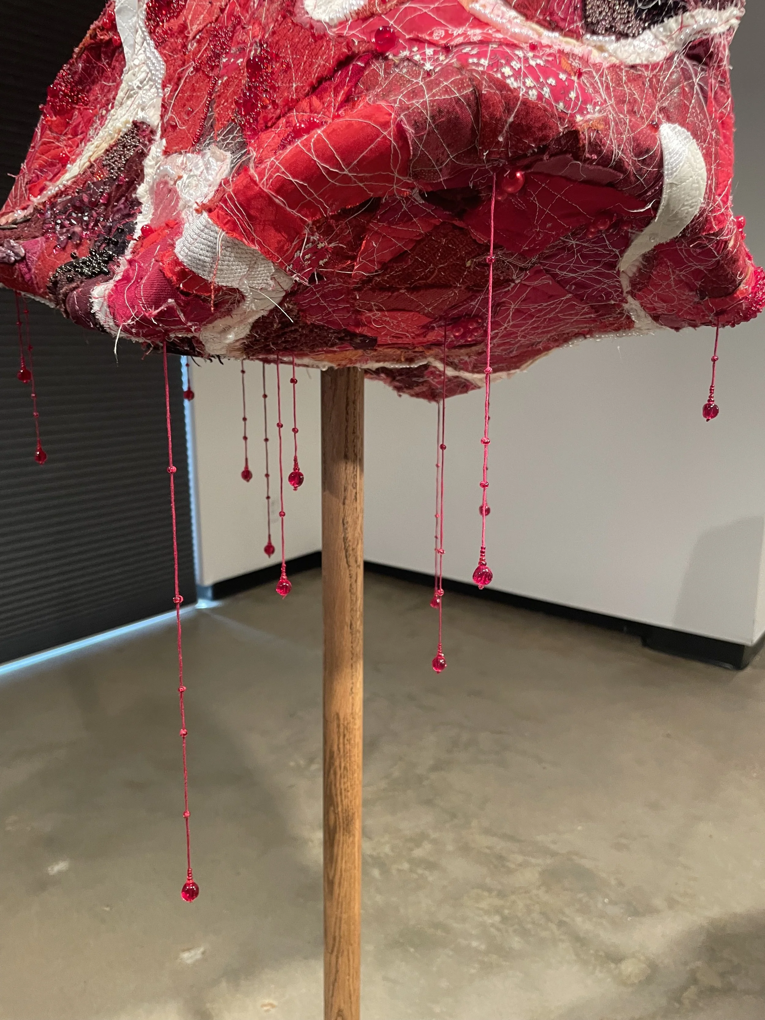 "RAW (meatstick)", 2026. Assorted collaged fabric, thread, wood, wire, pearls & beads. Featured in the 2026 Senior Thesis Exhibition at Rhodes College. [SOLD]