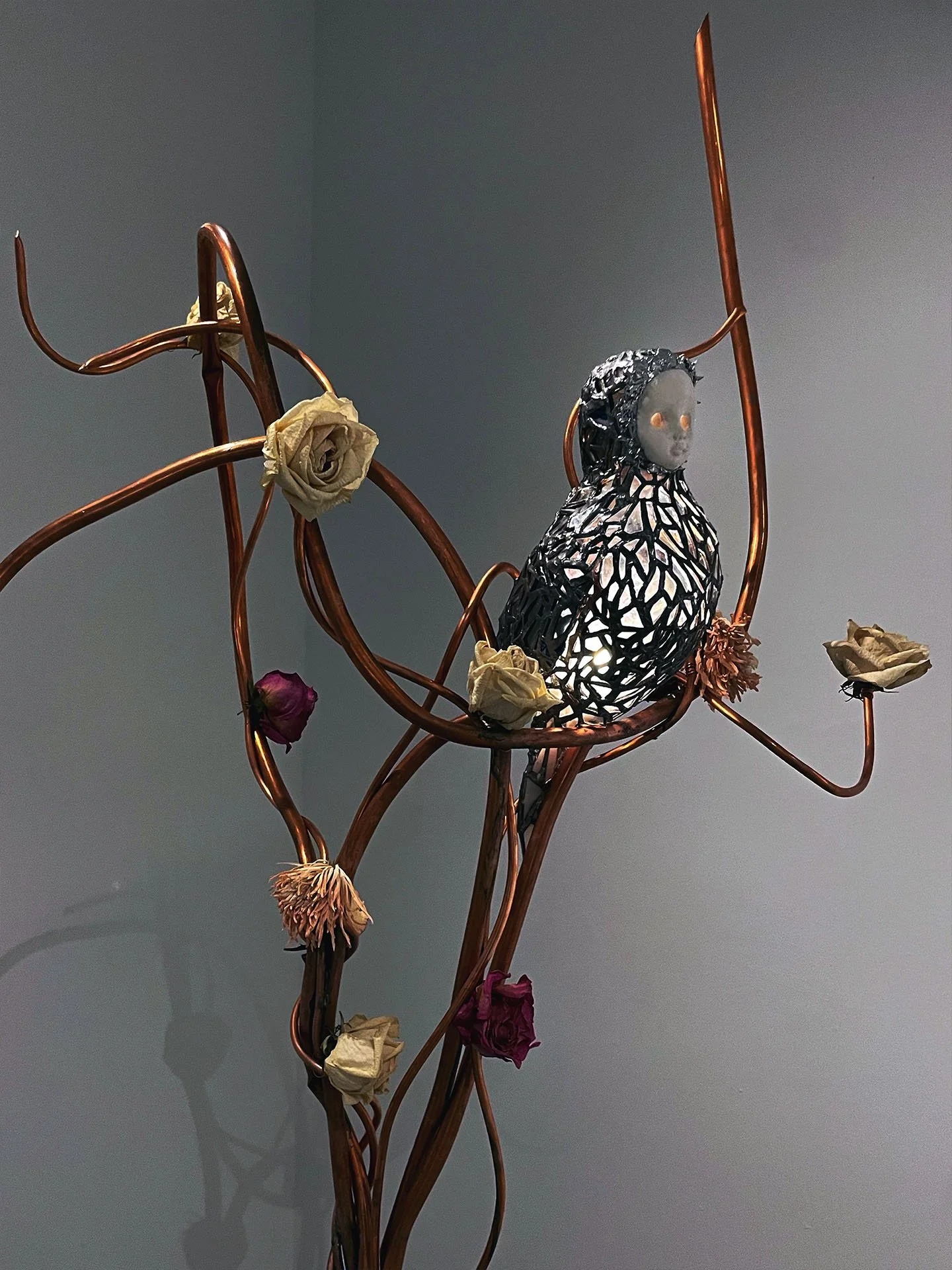 "And You Were There Too (Spring Wedding 1996)", 2025. Stained glass & ceramics, solder, plaster, copper, light bulb & socket, dried flowers