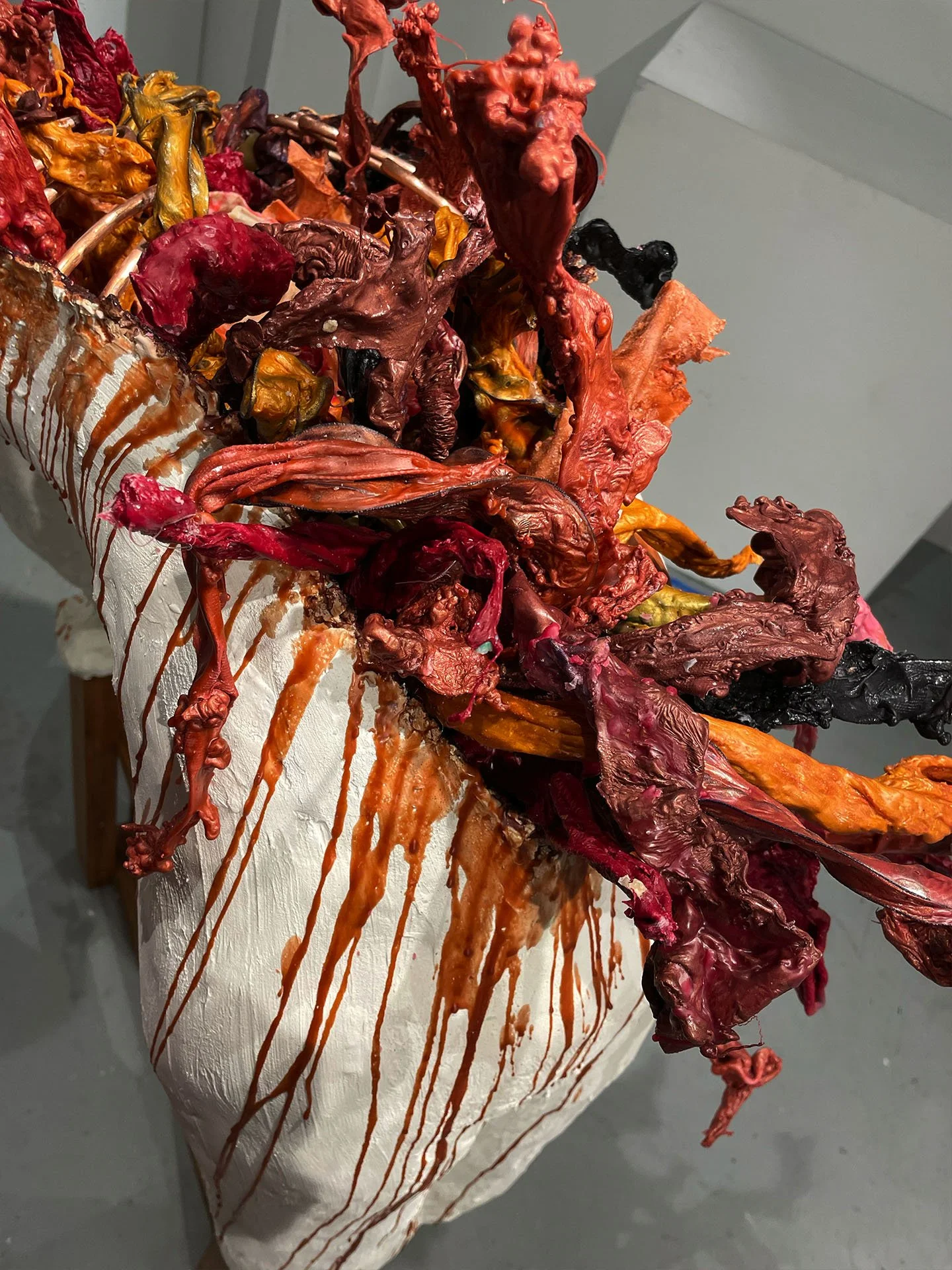 "Spill Your Guts", 2025. Beeswax & thermoplastic wax, plaster, copper, old barn wood.