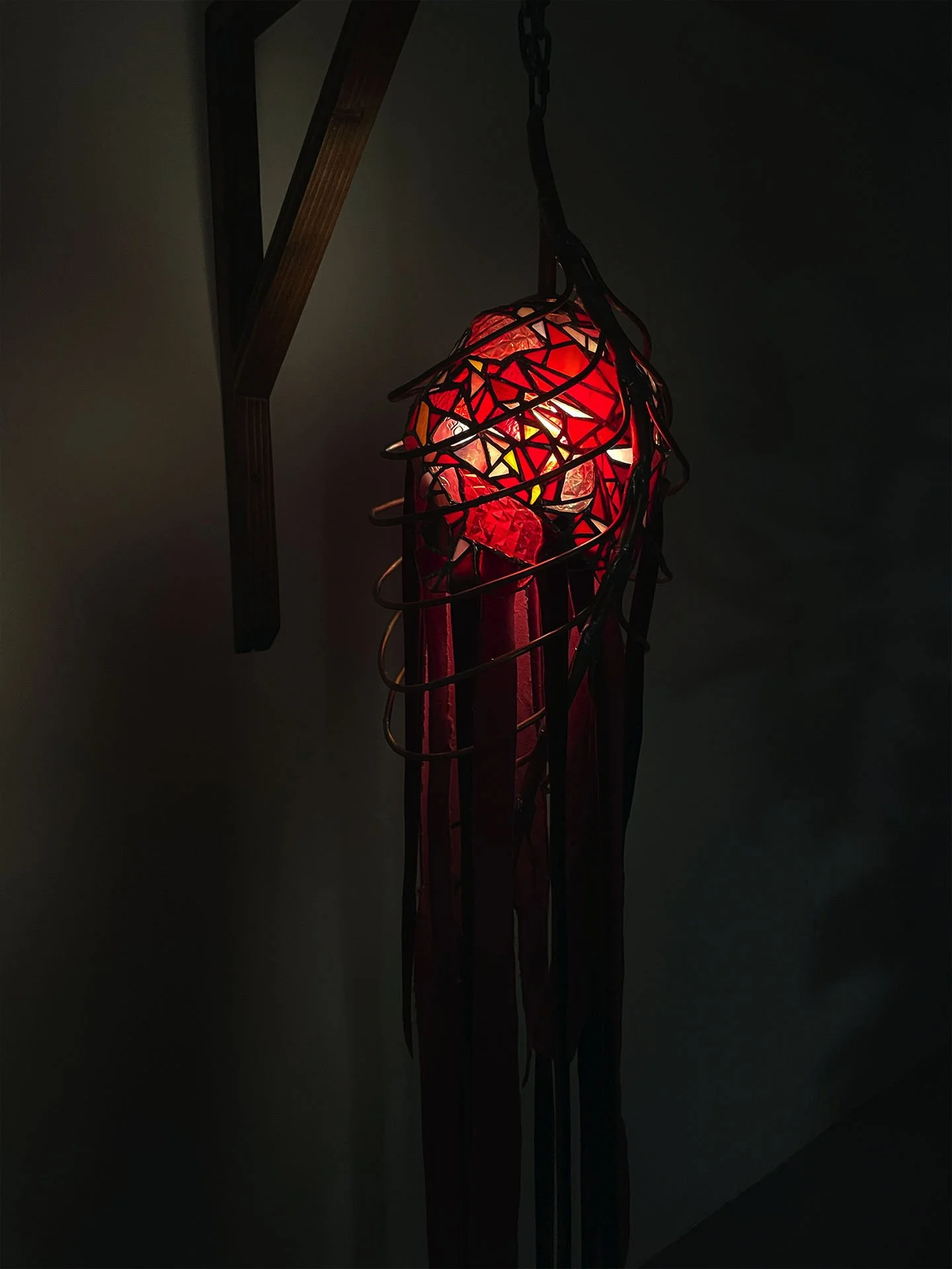"Cadavera Vero Innumera", 2025. Stained glass, copper, solder, velvet, pine wood, chain, LED lights.