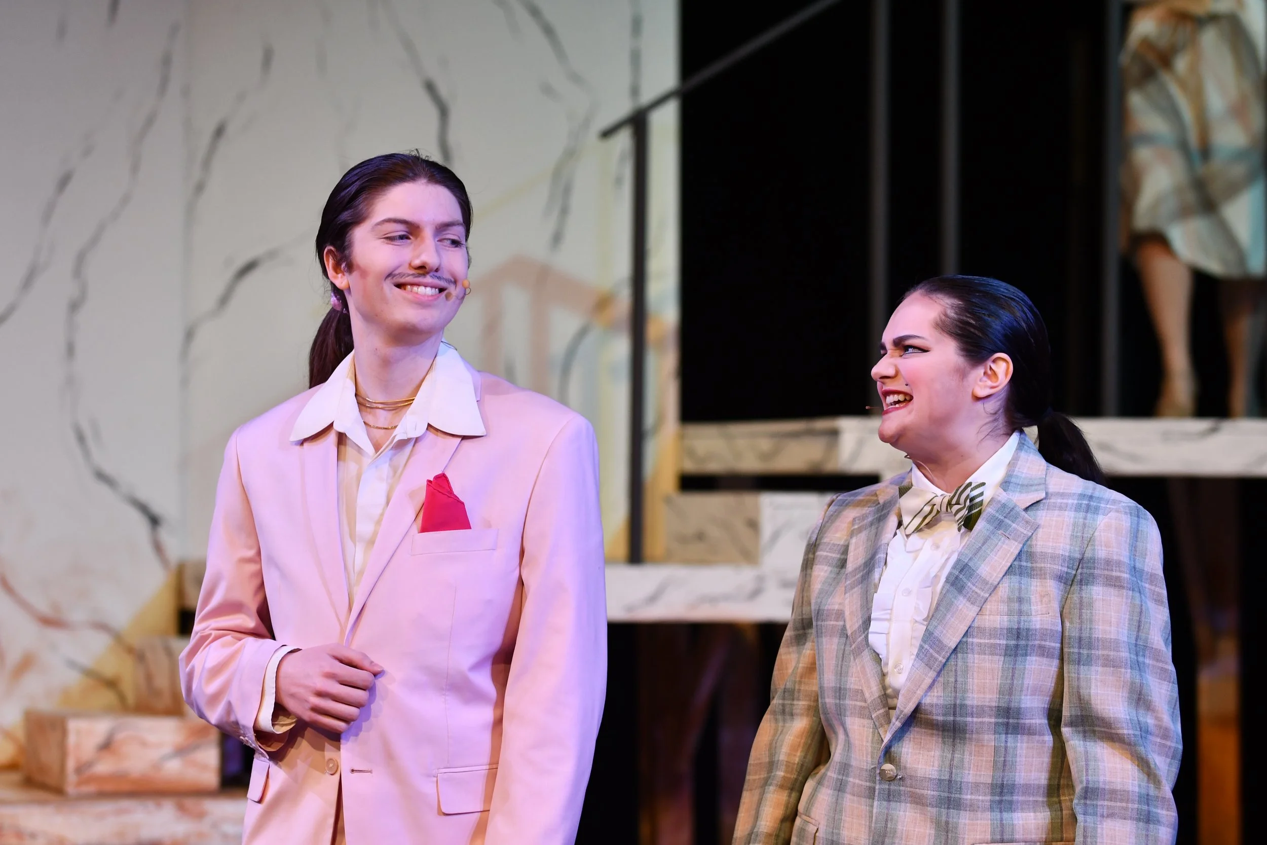 "Urinetown", Spring 2026. Directed by Claire D. Kolheim. Written by Greg Kotis. Photo: Emma Wyckoff (left), Lily Russell (right).