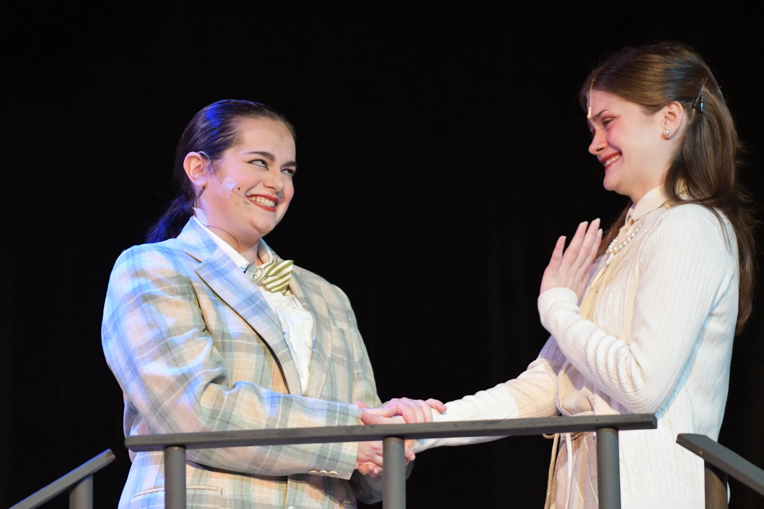 "Urinetown", Spring 2026. Directed by Claire D. Kolheim. Written by Greg Kotis. Photo: Lily Russell (left), Lilith Dyson (right).