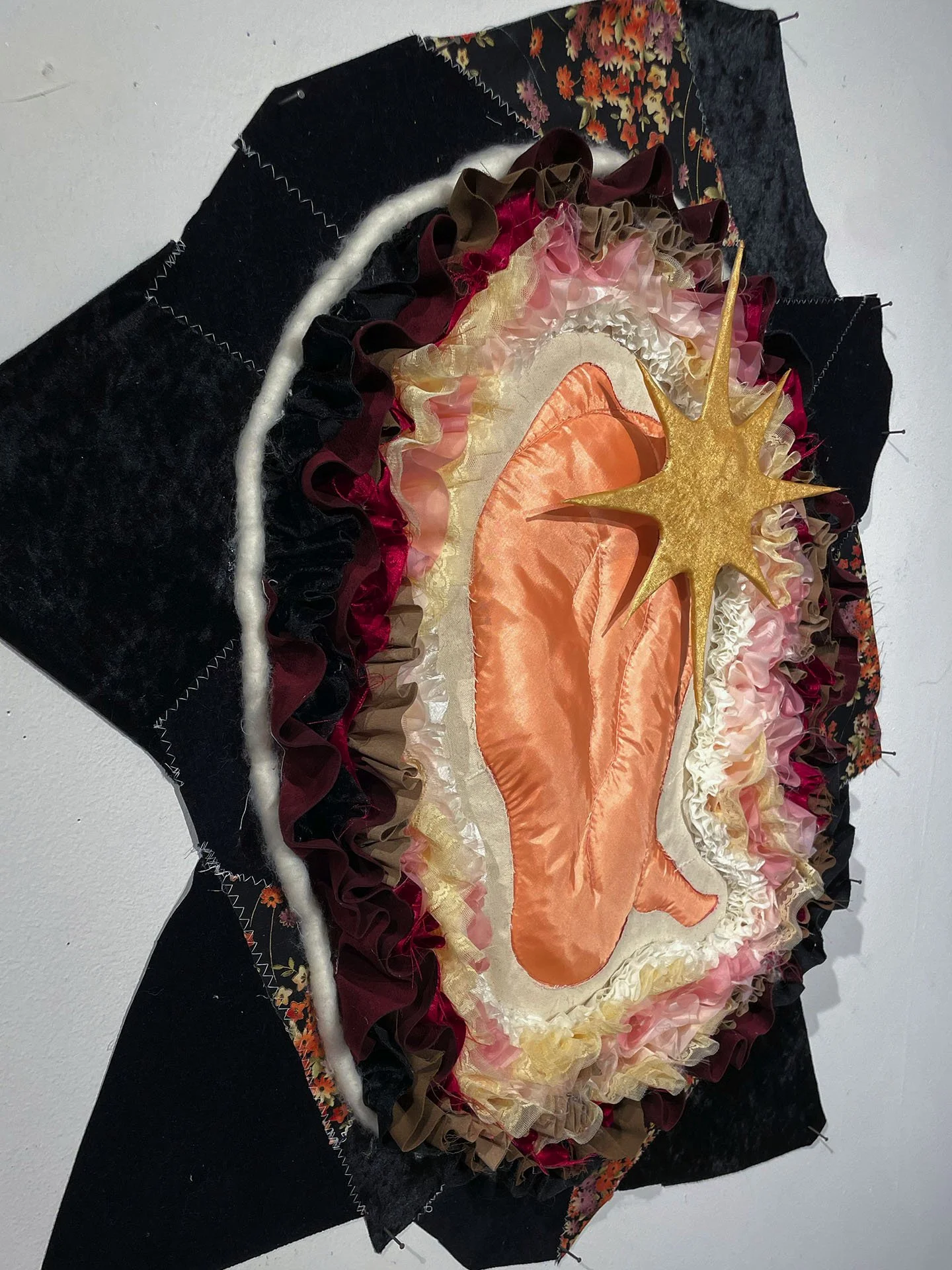 "Soulbirth", 2026. Various polyester fabrics, canvas, cotton, suede, embroidery floss, cardboard, Polyfill, small nails.
Featured in the 2026 Senior Thesis Exhibition at Rhodes College.