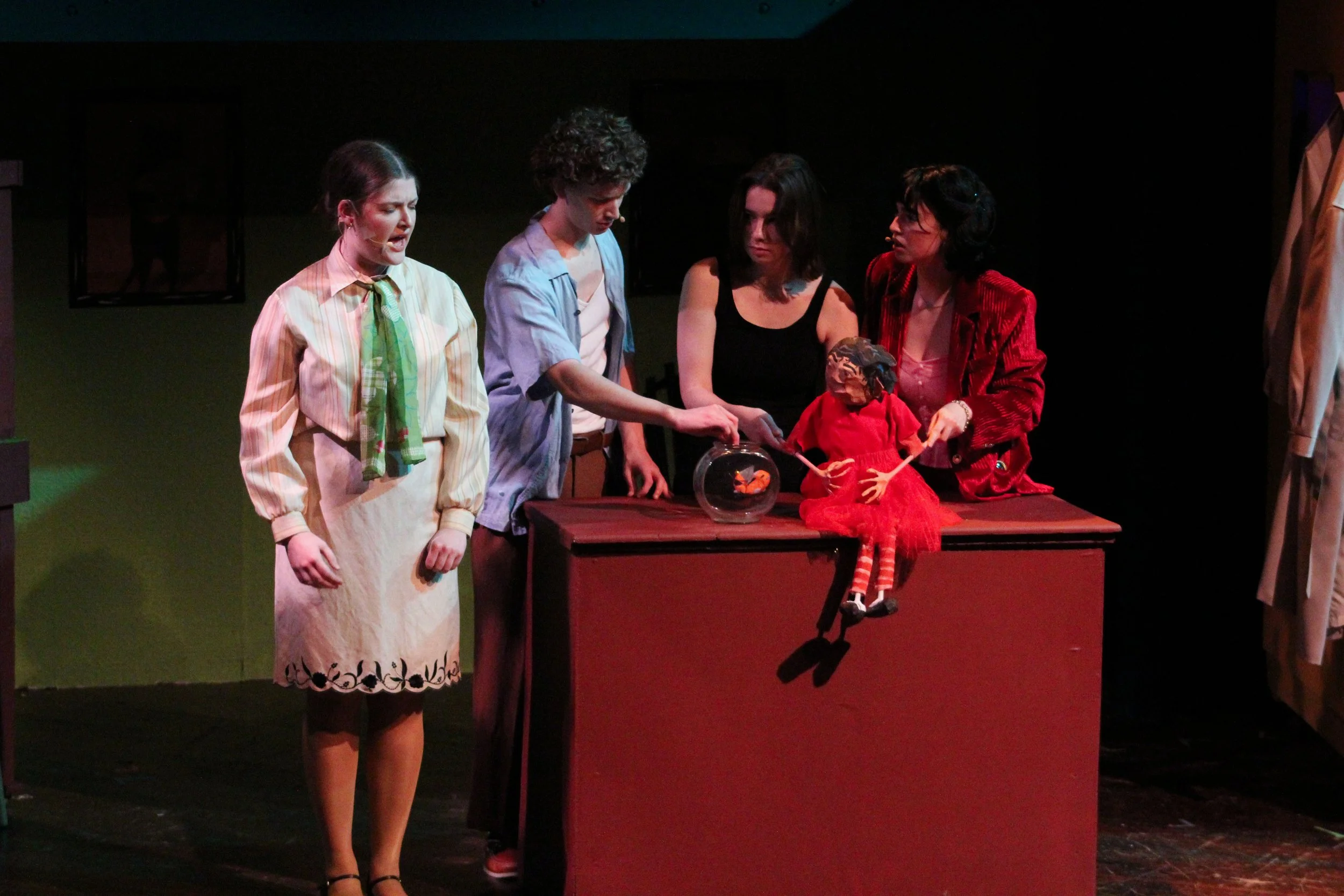 "Amélie", Spring 2024. Directed by Aliza Moran. Written by Craig Lucas, Daniel Messé, & Nathan Tysen. Photo: (left to right) Marianne Gebb, Elliot Robinson, Hilde Robinson, Eliza Fleming.