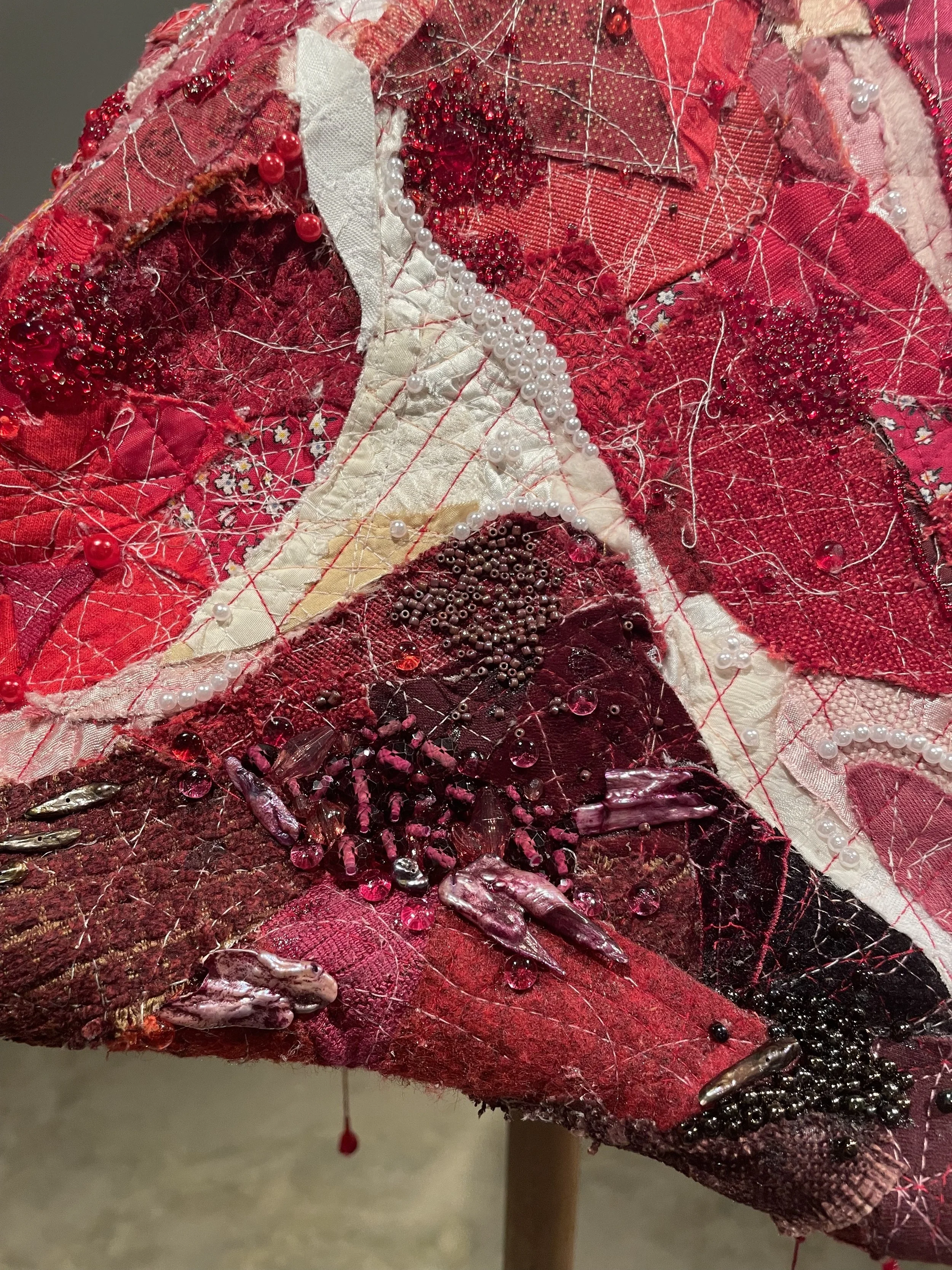 "RAW (meatstick)", 2026. Assorted collaged fabric, thread, wood, wire, pearls & beads. Featured in the 2026 Senior Thesis Exhibition at Rhodes College. [SOLD]