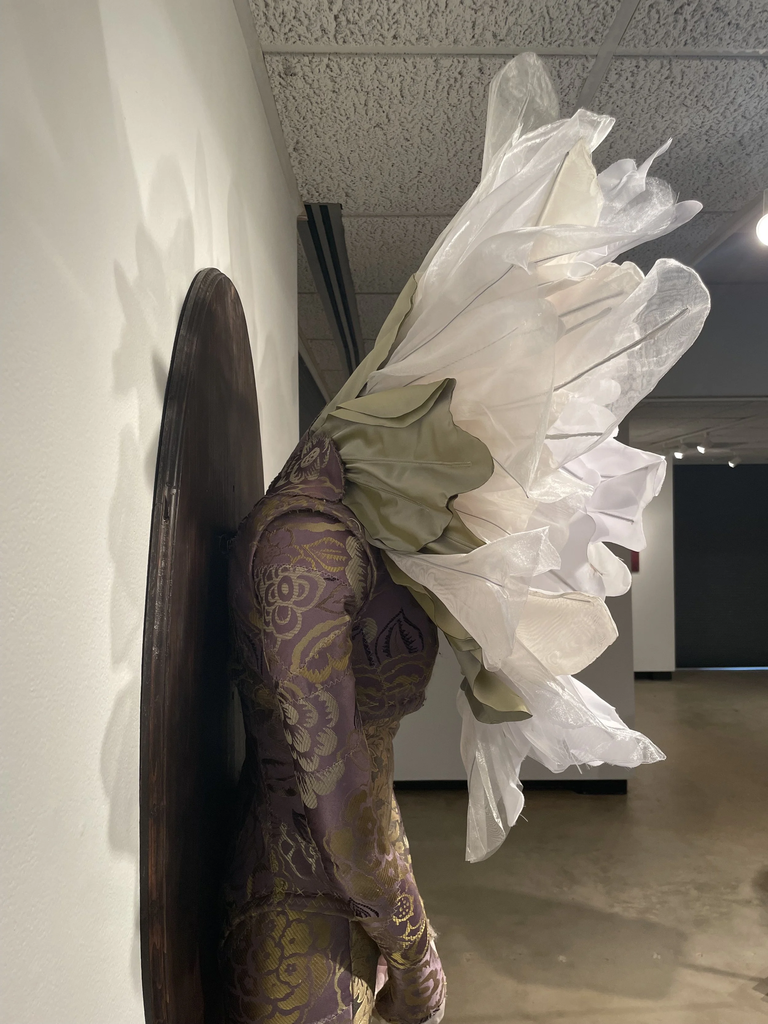 "Wallflower", 2026. Brocade, organza, polyester, Polyfill, wire, wood, resin. Featured in the 2026 Senior Thesis Exhibition at Rhodes College.