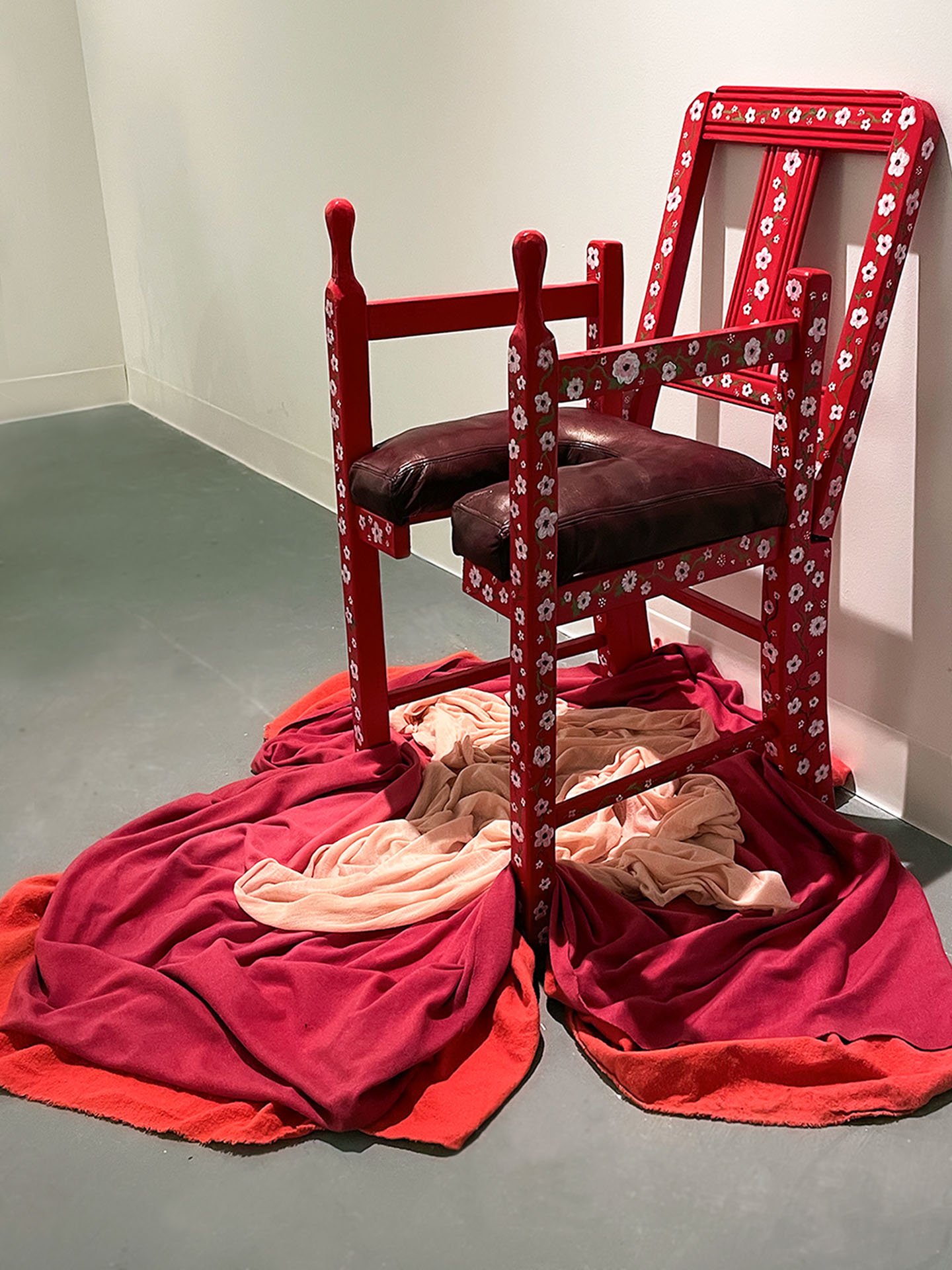 "Mama's Chair (Birthing Chair)", 2023. Discarded children’s chair, wood, leather, paint, hand-dyed fabric