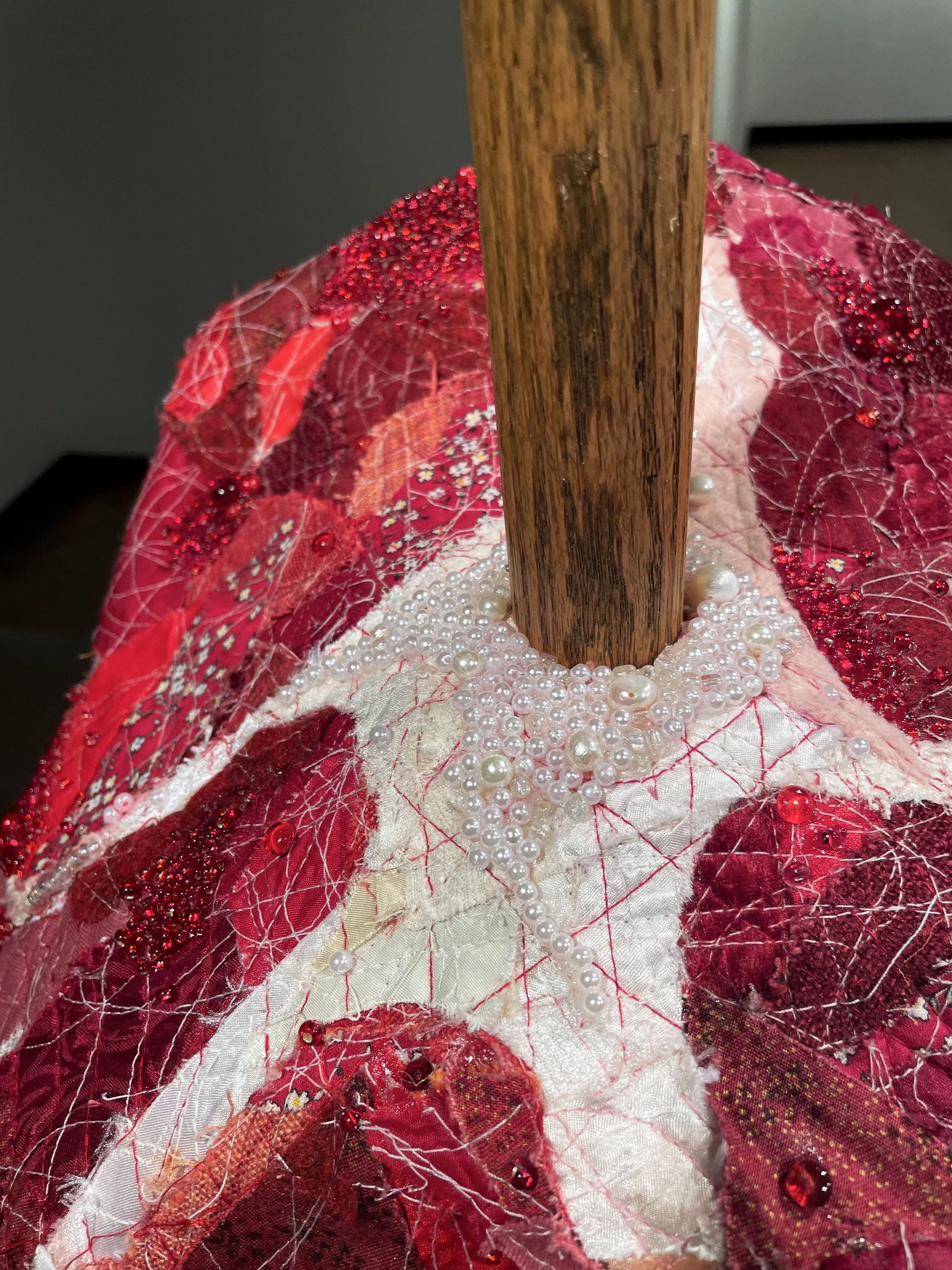 "RAW (meatstick)", 2026. Assorted collaged fabric, thread, wood, wire, pearls & beads. Featured in the 2026 Senior Thesis Exhibition at Rhodes College. [SOLD]