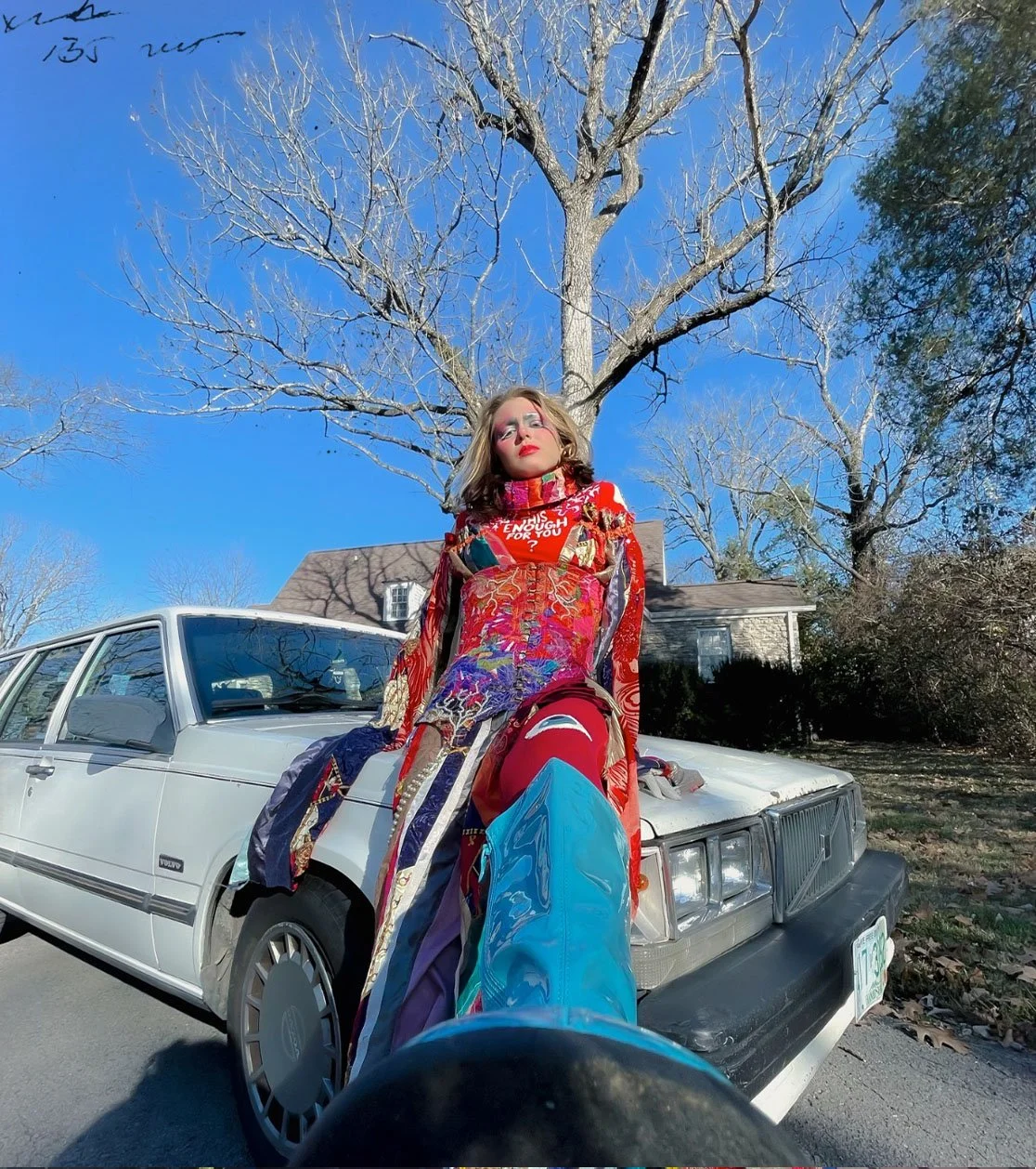 "IS THIS ENOUGH FOR YOU? (Patchwork No.1)", 2023. From the Patchwork Photo Series. 
Various fabrics, pearl beads, chain, boning, brass eyelets & fasteners, pleather boots, bodysuit, paint.
Makeup & Photography by Lillian Hall.