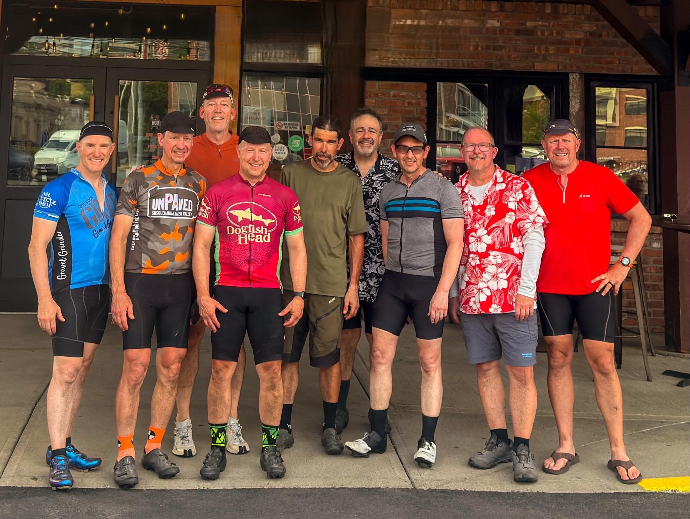 Group photo celebrating at Dinosaur Bar-B-Que after completing the five-day Erie Canal gravel ride