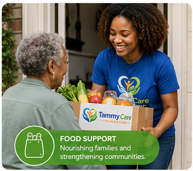 A young woman with curly hair in a blue Tammy Care Foundation t-shirt hands a box of fresh produce to an elderly woman with gray hair at her home.