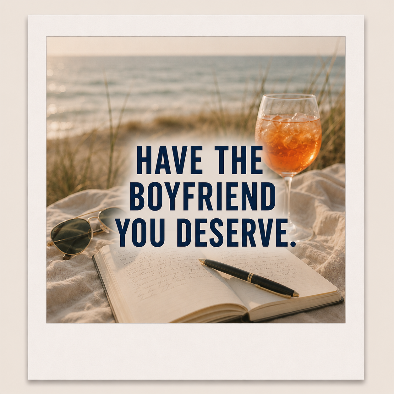 A photo featuring a beach scene with an open journal, a pen, sunglasses, and a glass of rosé wine on a blanket. The background shows a sandy shore and ocean waves, with the text 'Have the boyfriend you deserve' overlayed.