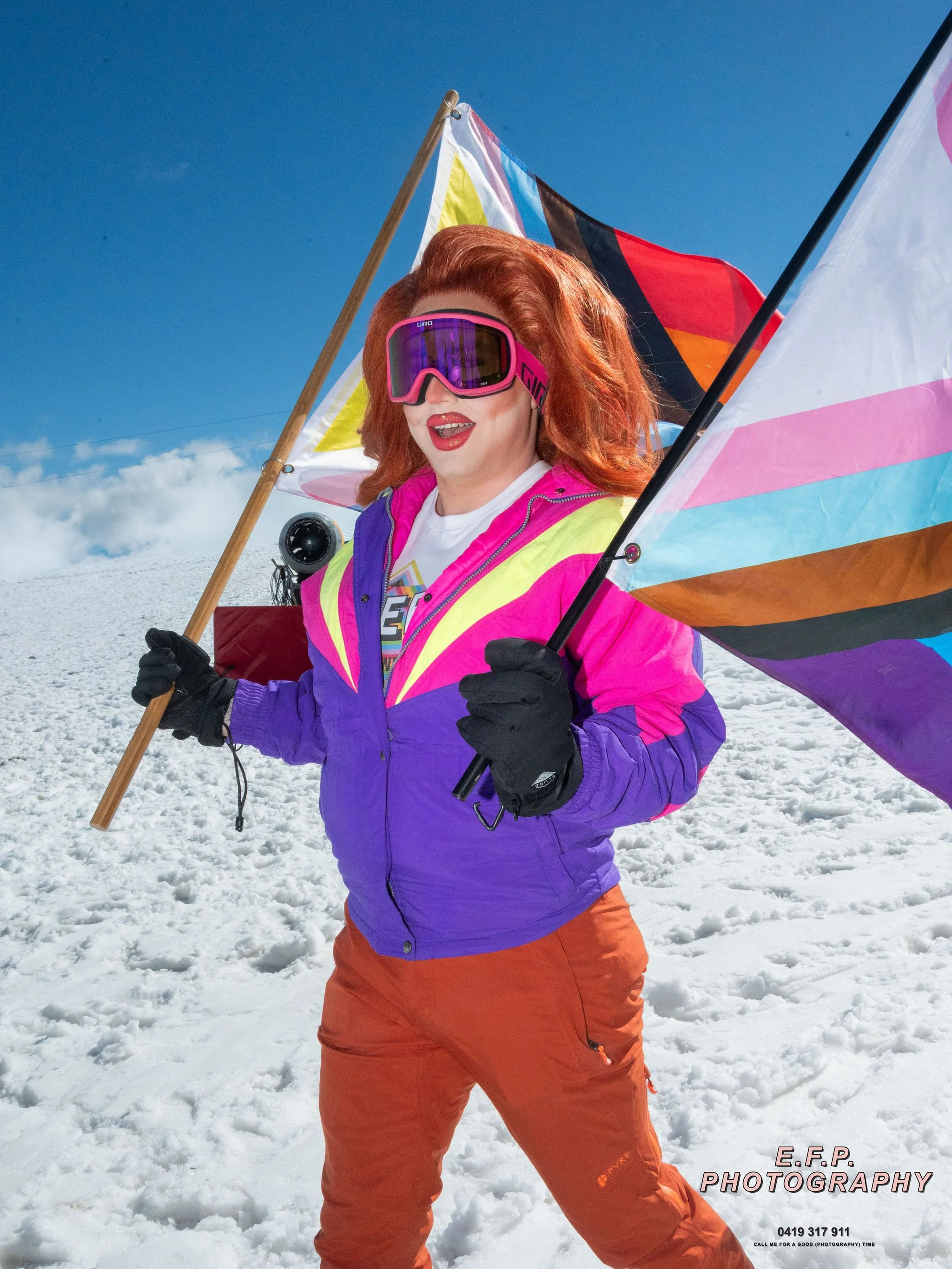 Drag queen at the snow with flags
